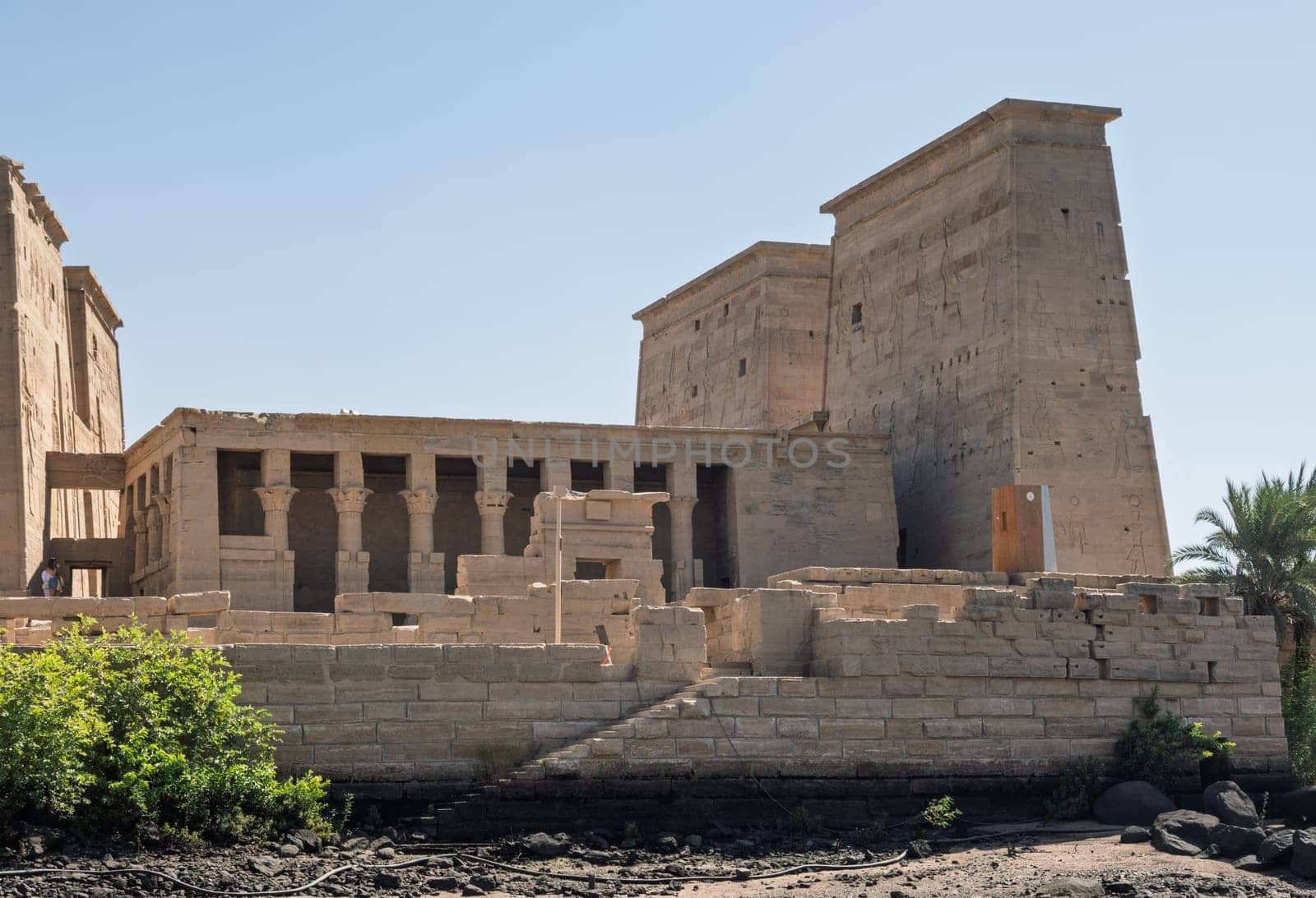 Side view of the reconstructed Philae Temple on an island in Aswan Harbor or Reservoir formed by the Low Dam on the Nile