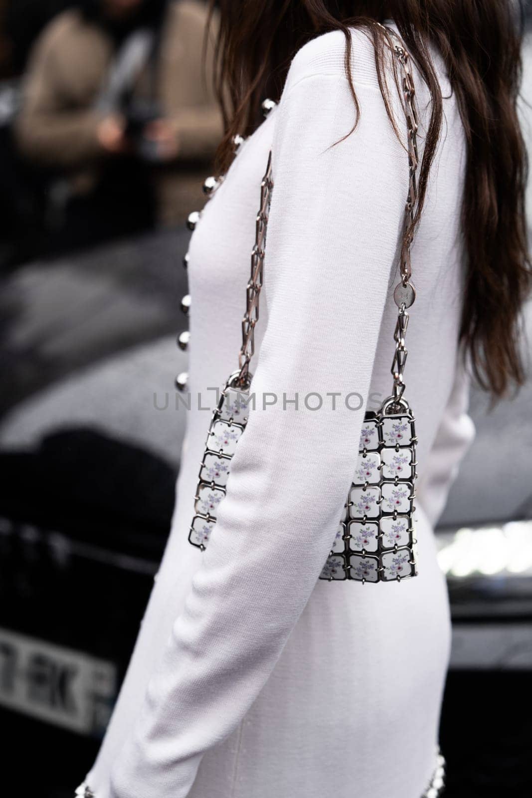Paris, France - February, 29, 2024: woman wears Rabanne bag, fashion blogger outfit details, street style.