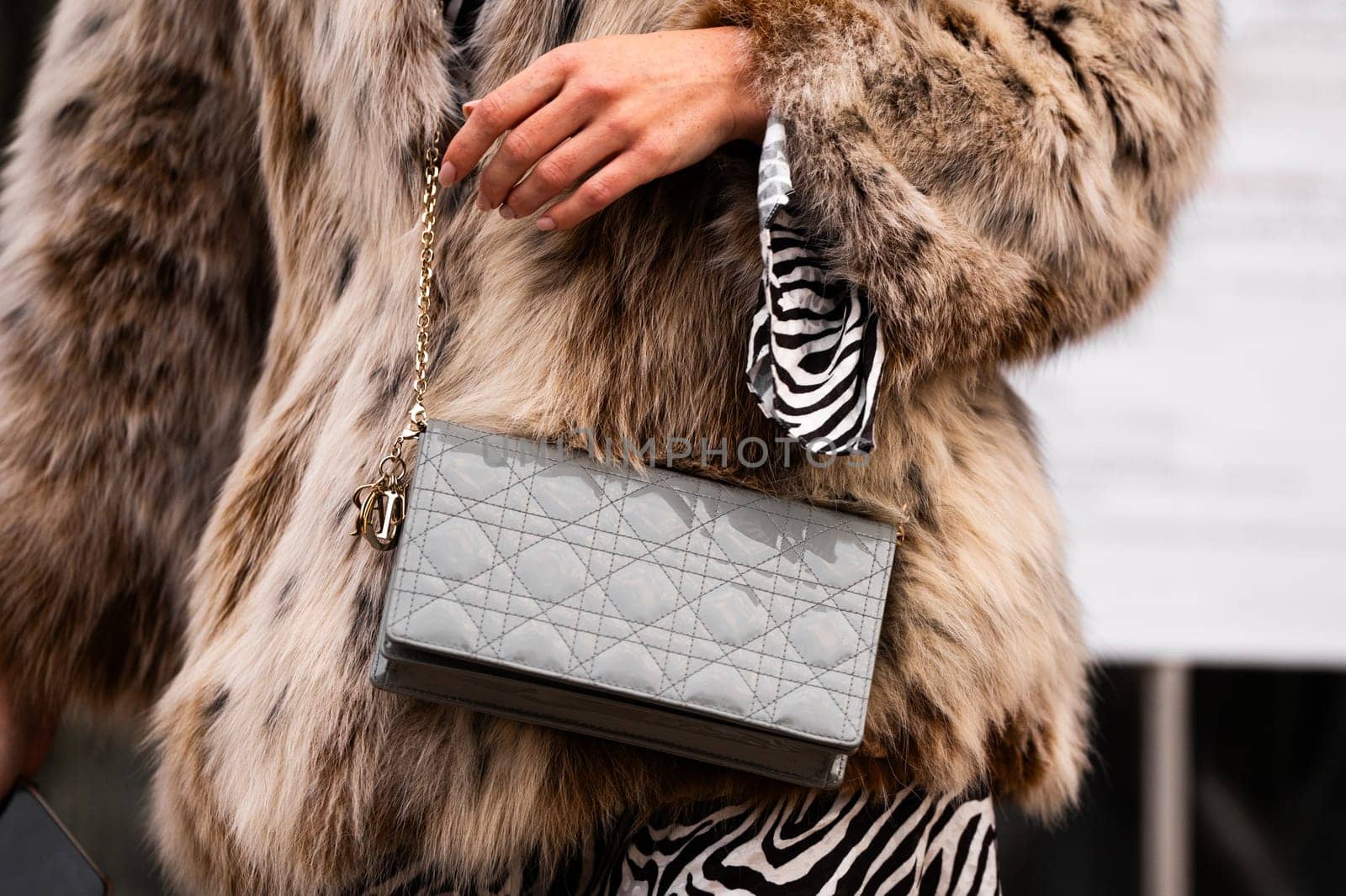 Milan, Italy - January, 24, 2024: woman wears Dior Lady bag, street style details, fashion outfit detail.