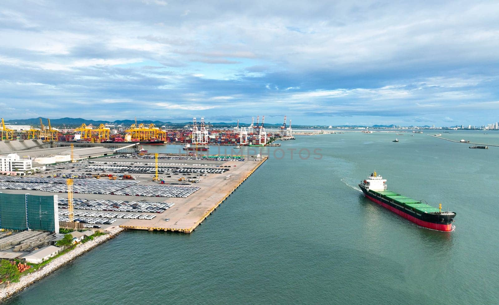 Rows of brand-new automobiles at a shipping port, awaiting transport for global trade. Industrial infrastructure, cargo containers, and supply chain logistics. Automotive export industry in action.