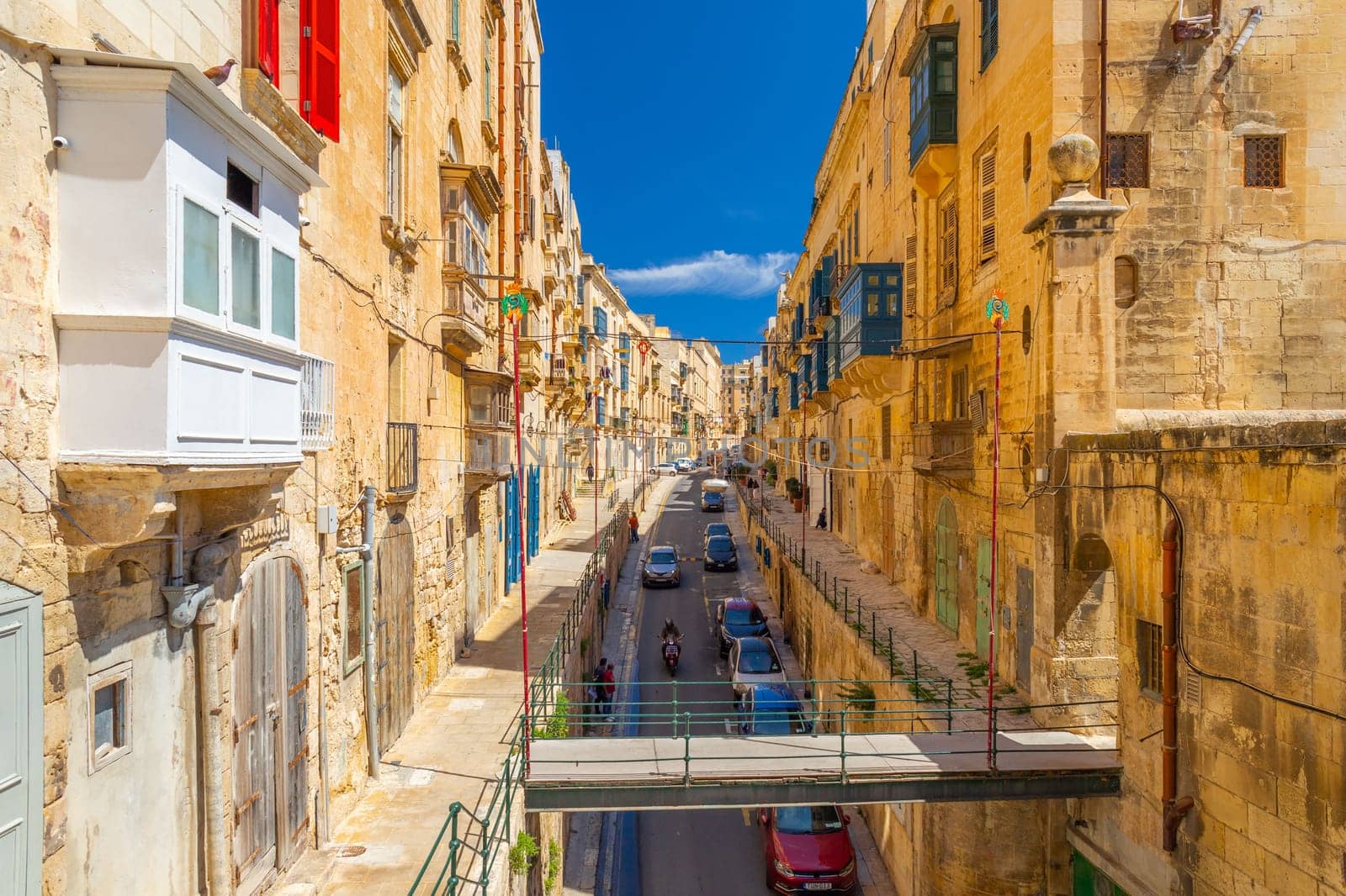 Valletta, Malta - April 2, 2025: View of the East Street with metal bridge leading to St Barbara Bastions over Victoria Gate
