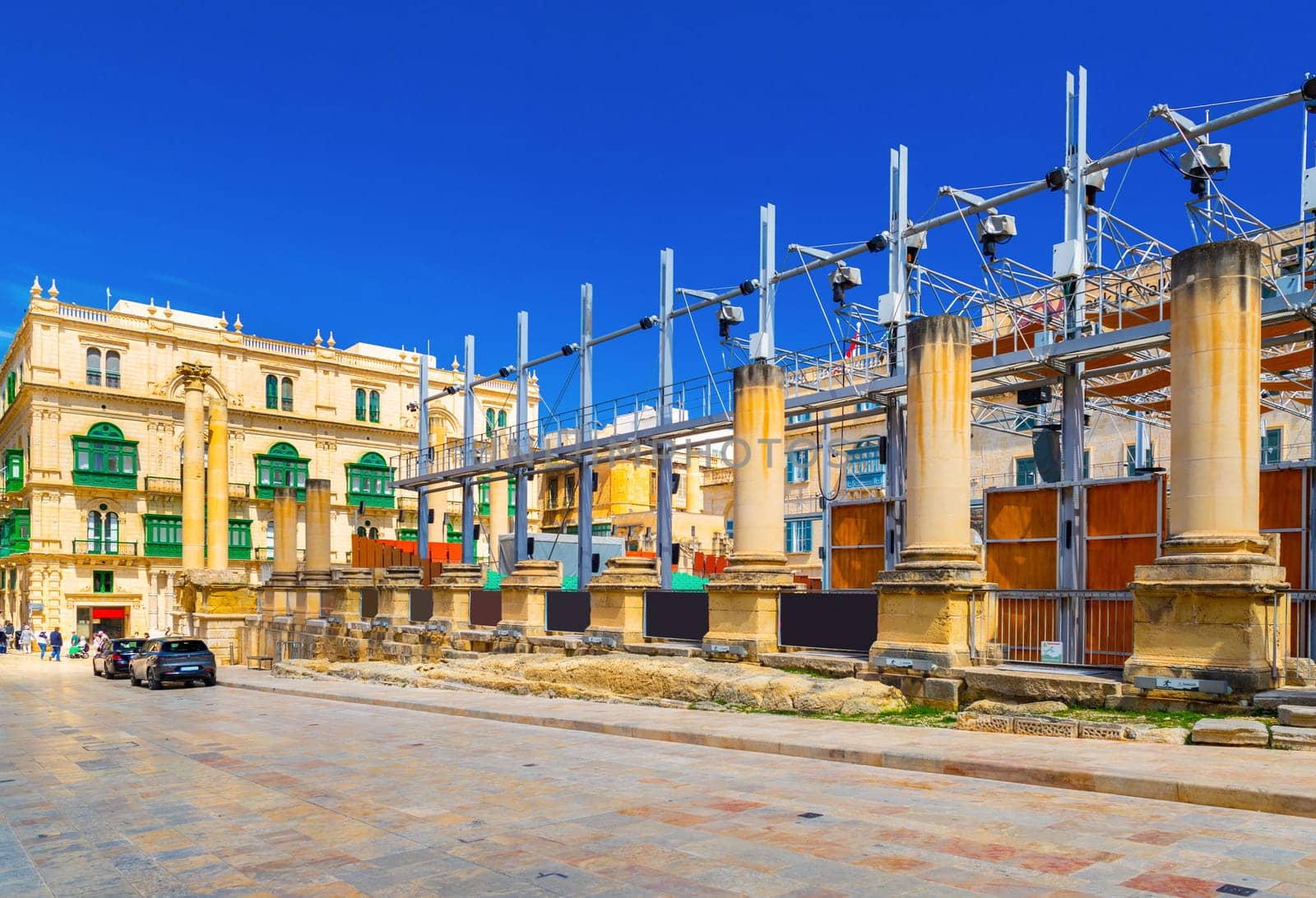 Valletta, Malta - April 2, 2025: View of the Royal Opera House Site and Palazzo Ferreria building with the clear blue sky in the background