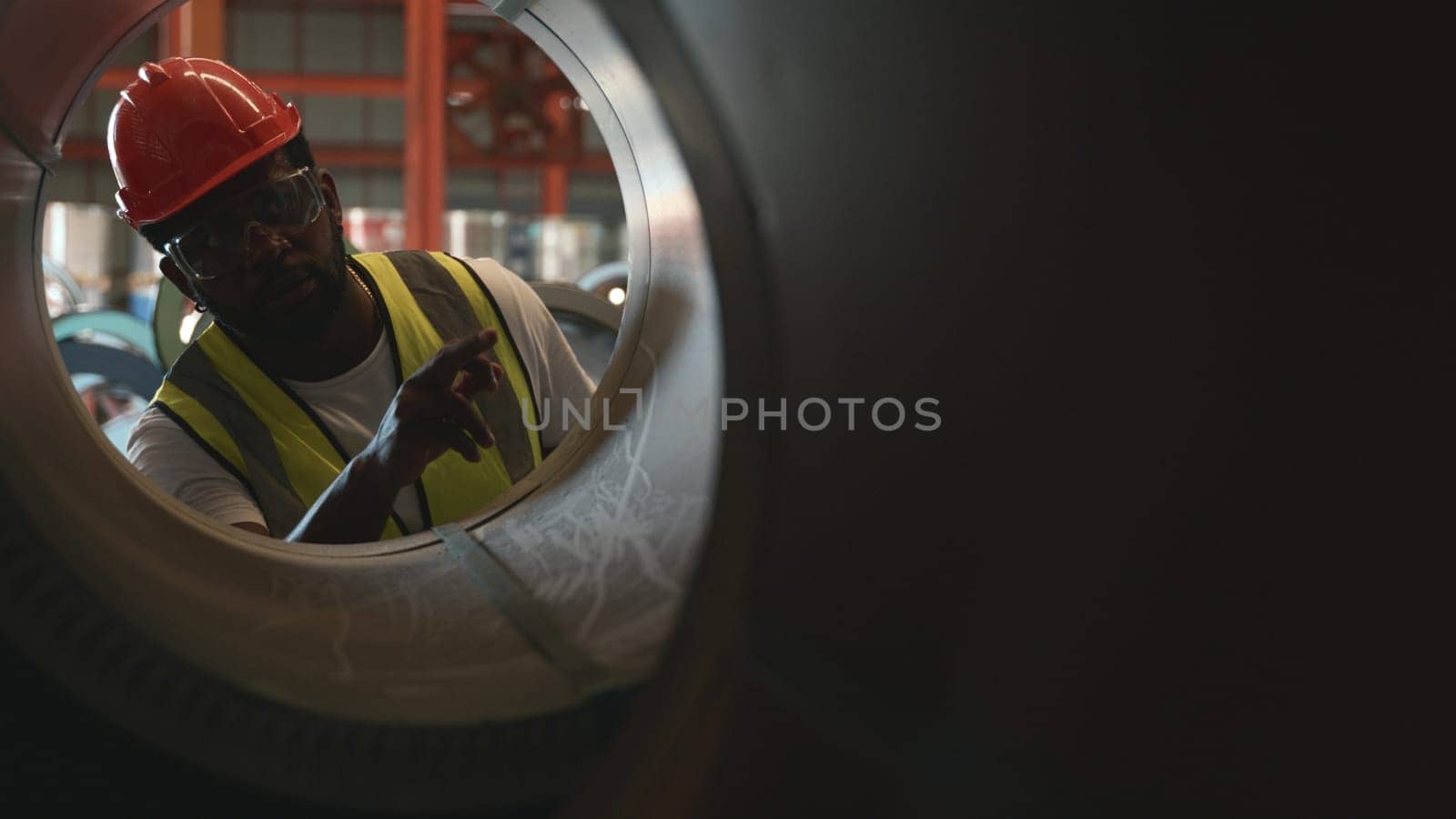 Engineer two worker man African black marking inspection on roll metal sheet before shipment in warehouse of Metal Sheet factory, Physical inventory count, checking stock industry