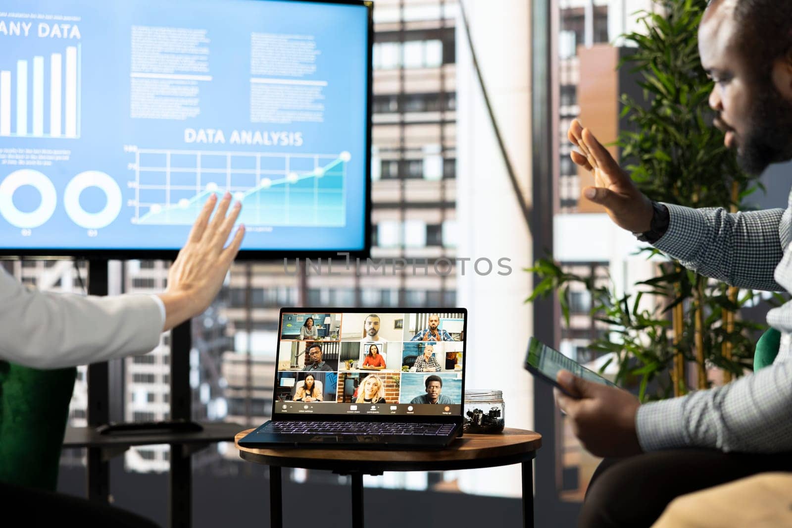 Managers waving hand, chatting with collaborators working from home, holding videoconference meeting using laptop to present new project. Supervisors saluting workers in remote videocall