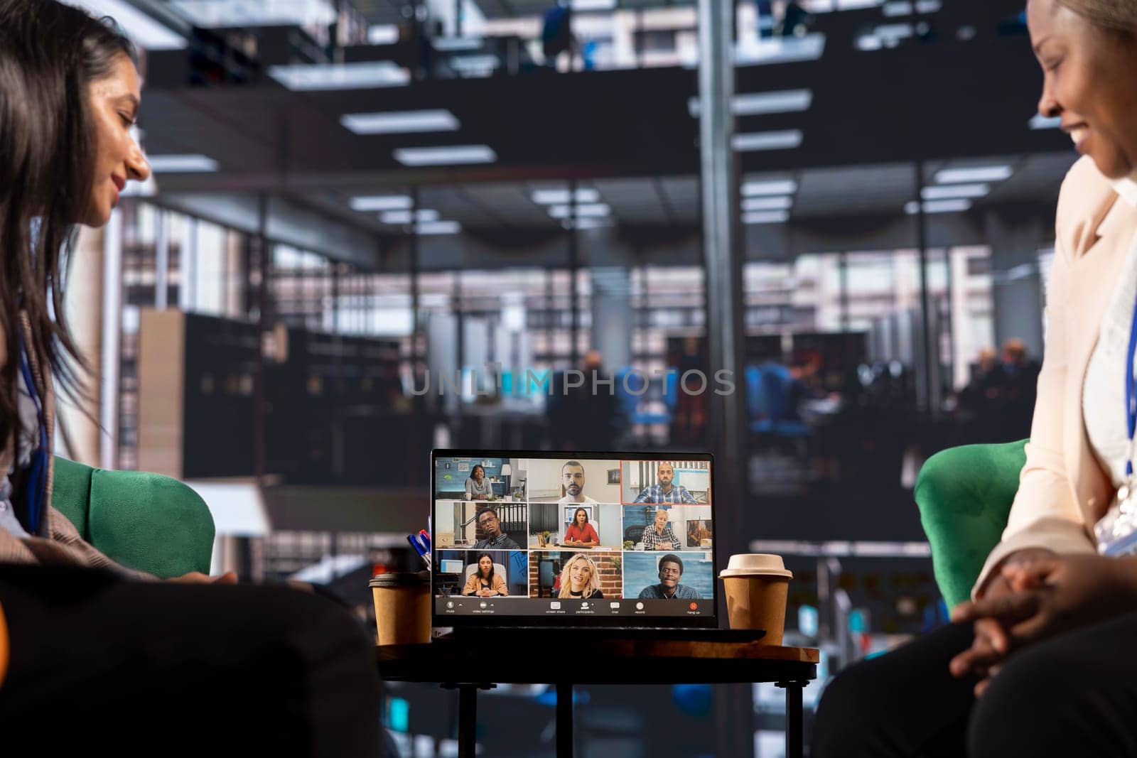 Multicultural team of women leaders hold an online conference call, showcasing collaboration and career growth in a professional, remote setting. Entrepreneurs discuss with investors group.
