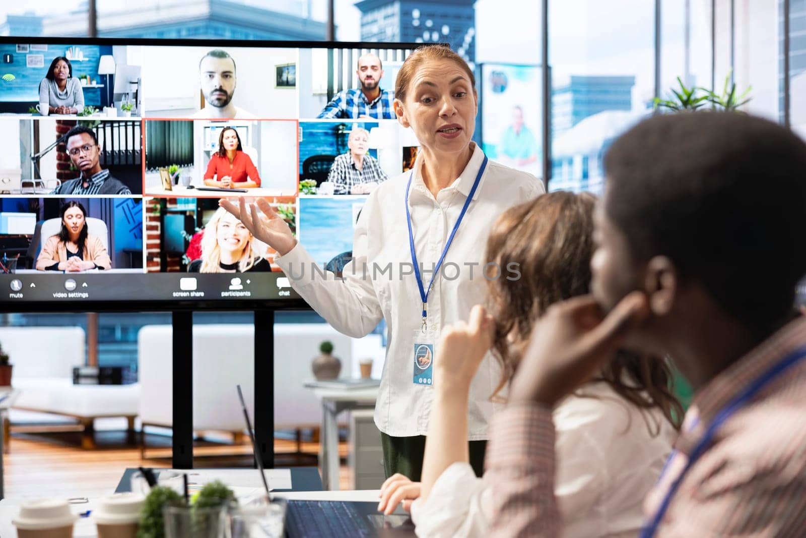 Diverse employees gather to discuss the progress of current projects on videocall, ensuring alignment with the strategic objectives. Management team and workers sharing their innovative ideas.