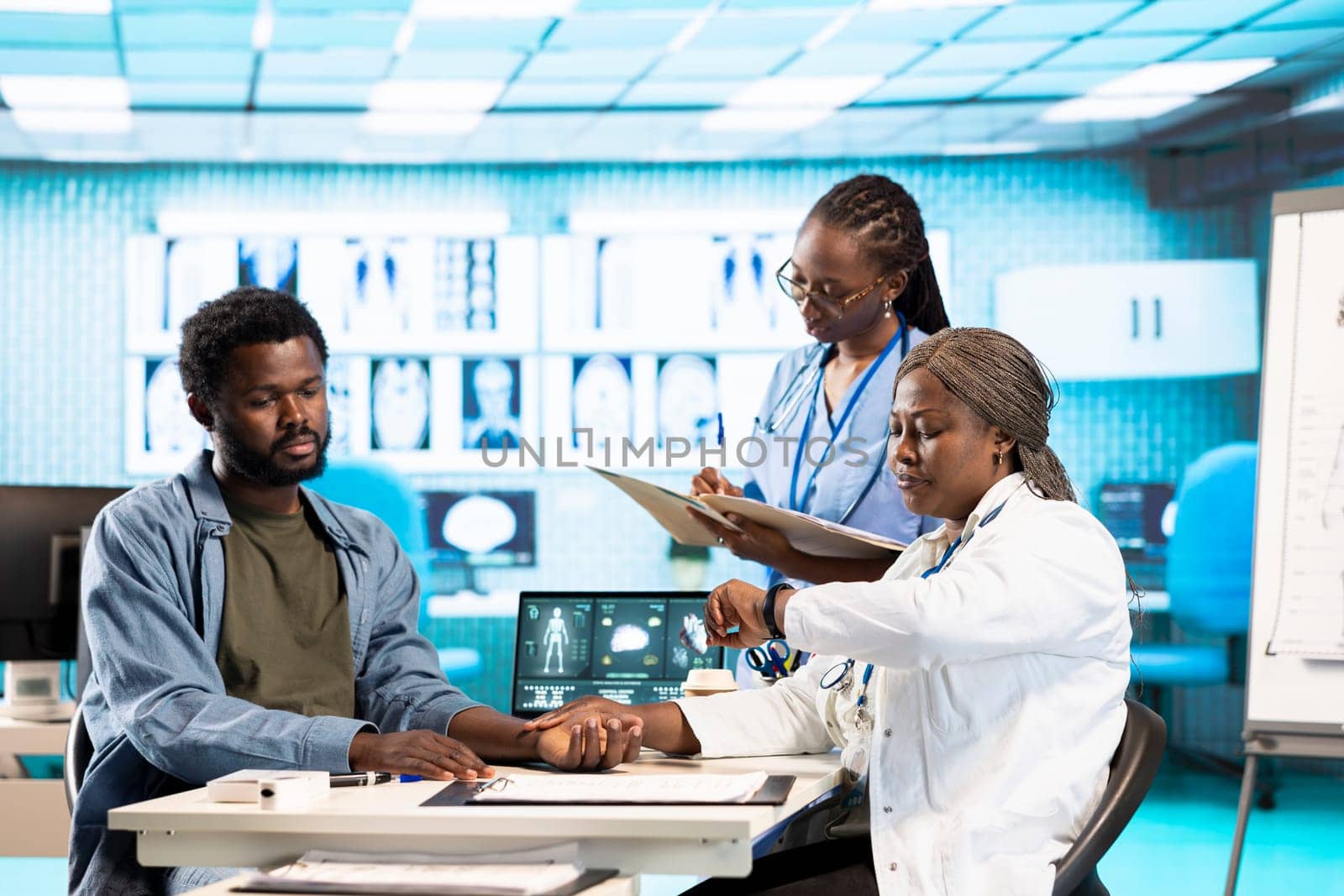 Physician measuring the heart rate of a young man by using her smartwatch, employing the digital fitness tracker accessory on her gadget. Patient and doctor interaction with tools.