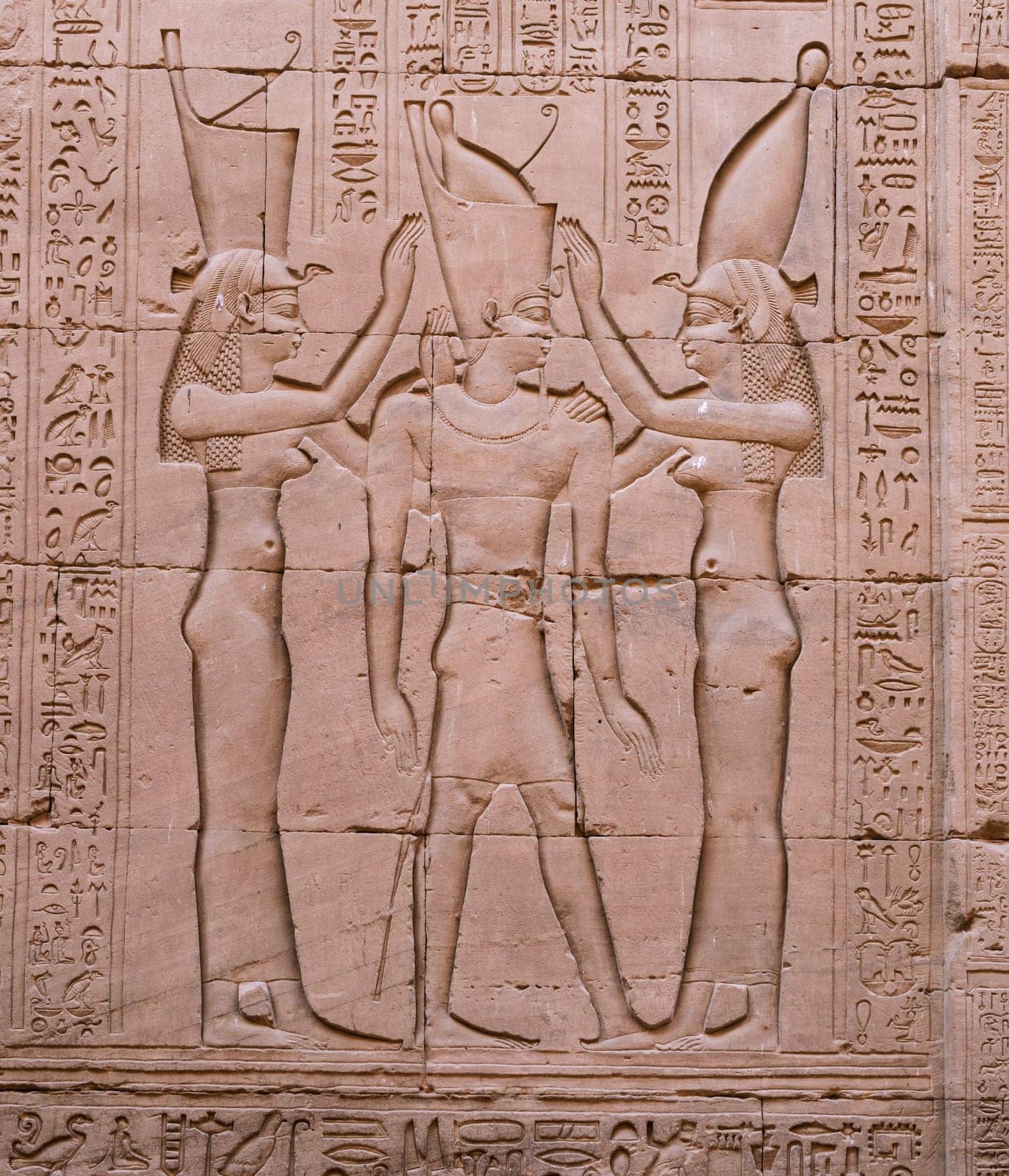 Detail of goddesses greeting pharoah in walls of Edfu Temple near Luxor in Egypt