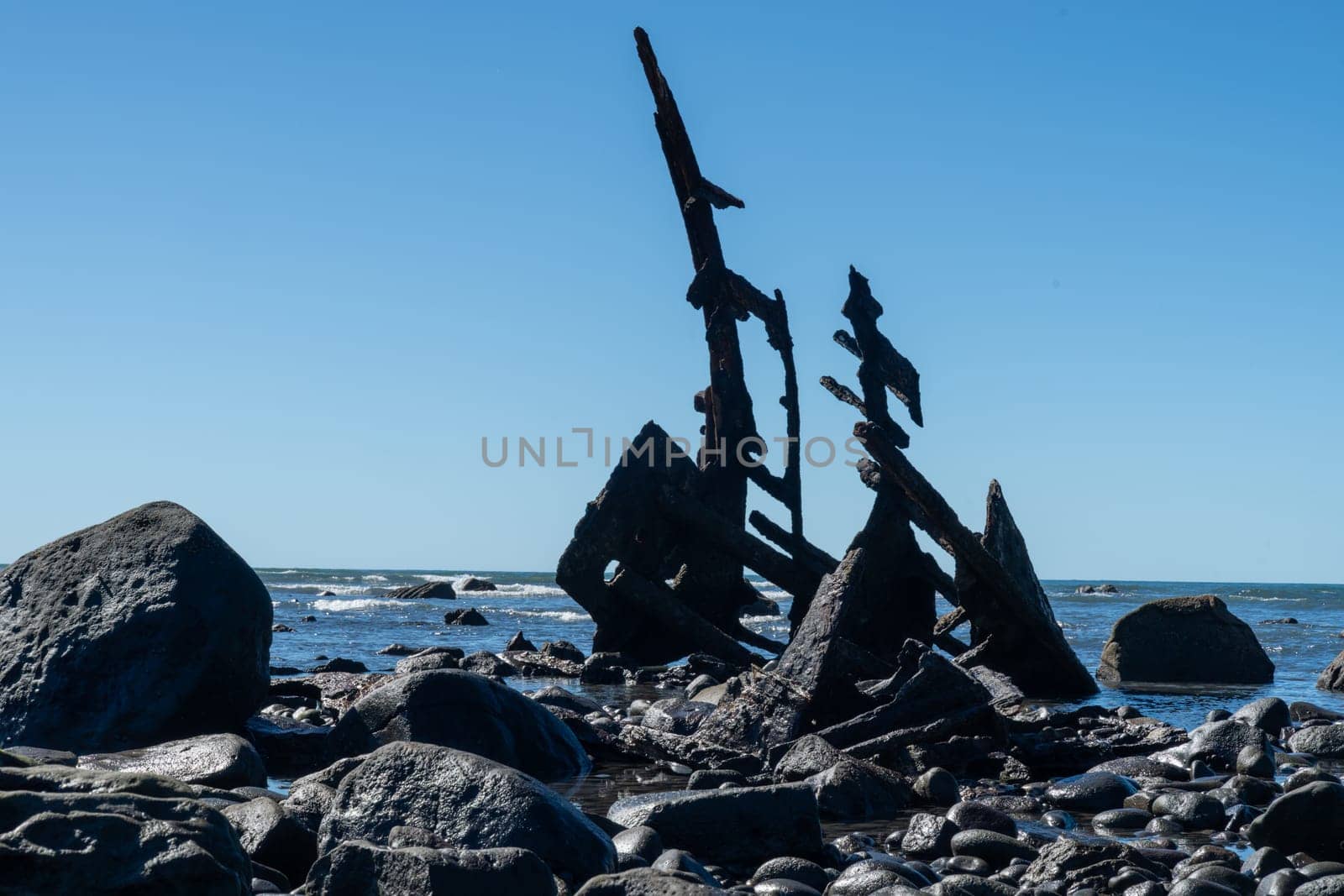 Shipwrecked remains of bow of Gairloch on south end Oakura beach New Plymouth.