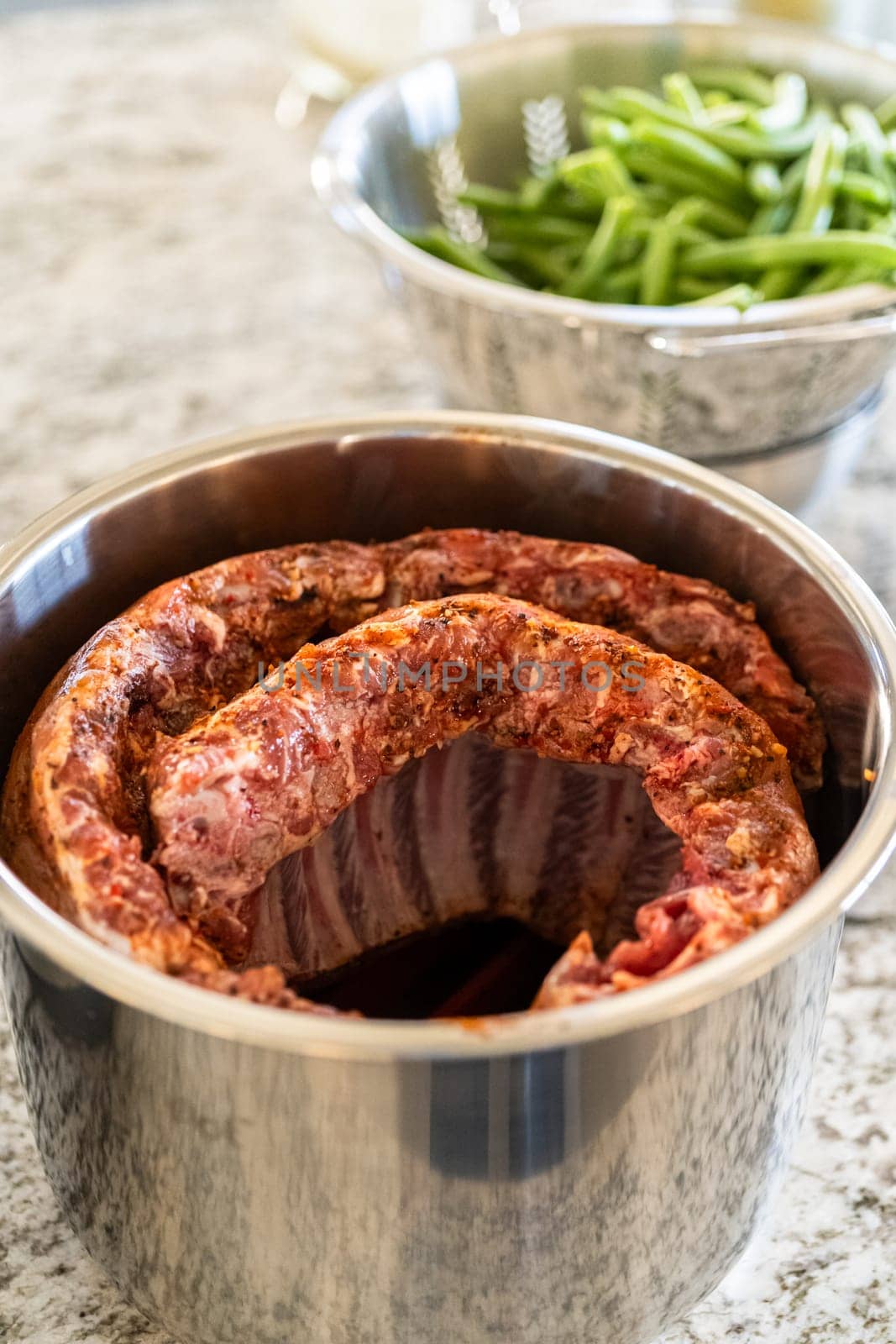In a sleek modern kitchen, were adding an extra layer of flavor to succulent baby back ribs by infusing them with a medley of spices in a multicooker-a mouthwatering feast in the making.