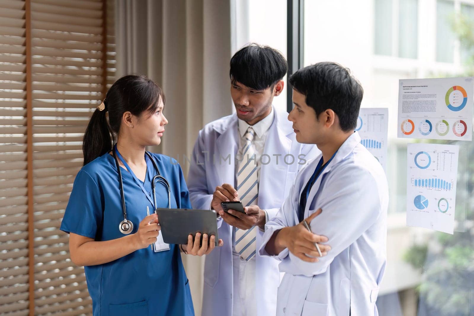 A healthcare team effectively collaborating by reviewing patient data insights, aiming for enhanced medical decision-making.