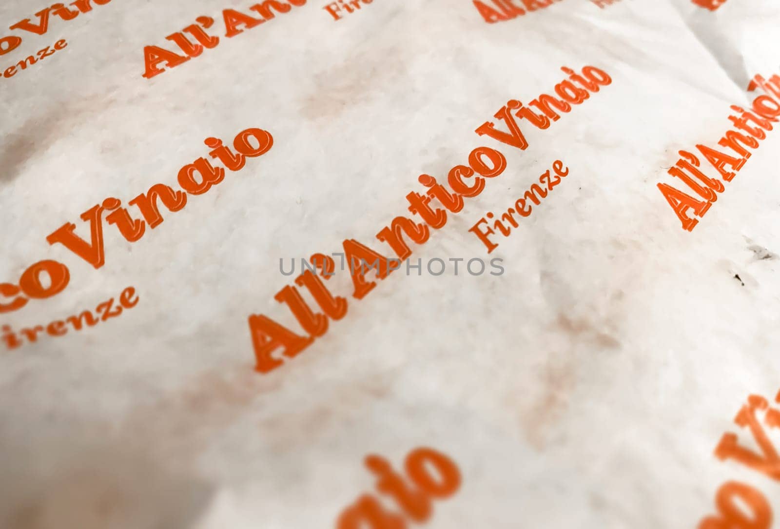 Florence, IT, June 2023: Paper packaging with the logo of All'Antico Vinaio. Renowned sandwich shop located in Florence, Italy. Illustrative editorial. Food and tradition