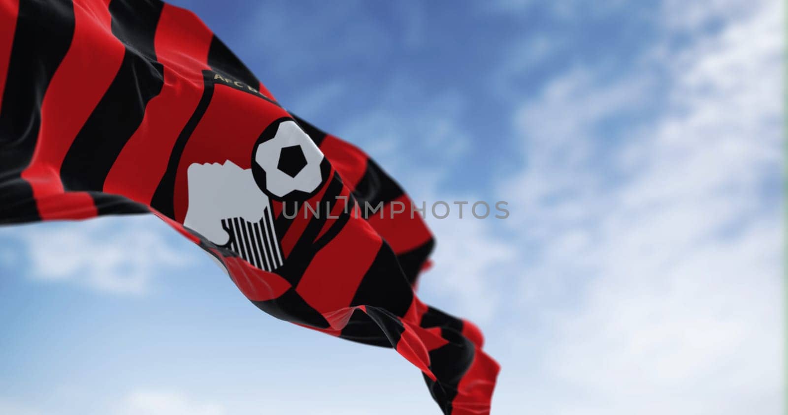 Bournemouth, UK, Oct. 2022: AFC Bournemouth flag waving. English football club based in Kings Park, Boscombe. Illustrative editorial 3d illustration render. Selective focus