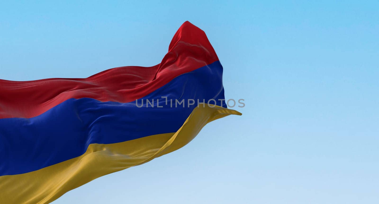 The national flag of Armenia waving in the wind on a clear day. Three horizontal bands in red, blue and apricot. 3d illustration render. Rippled textile