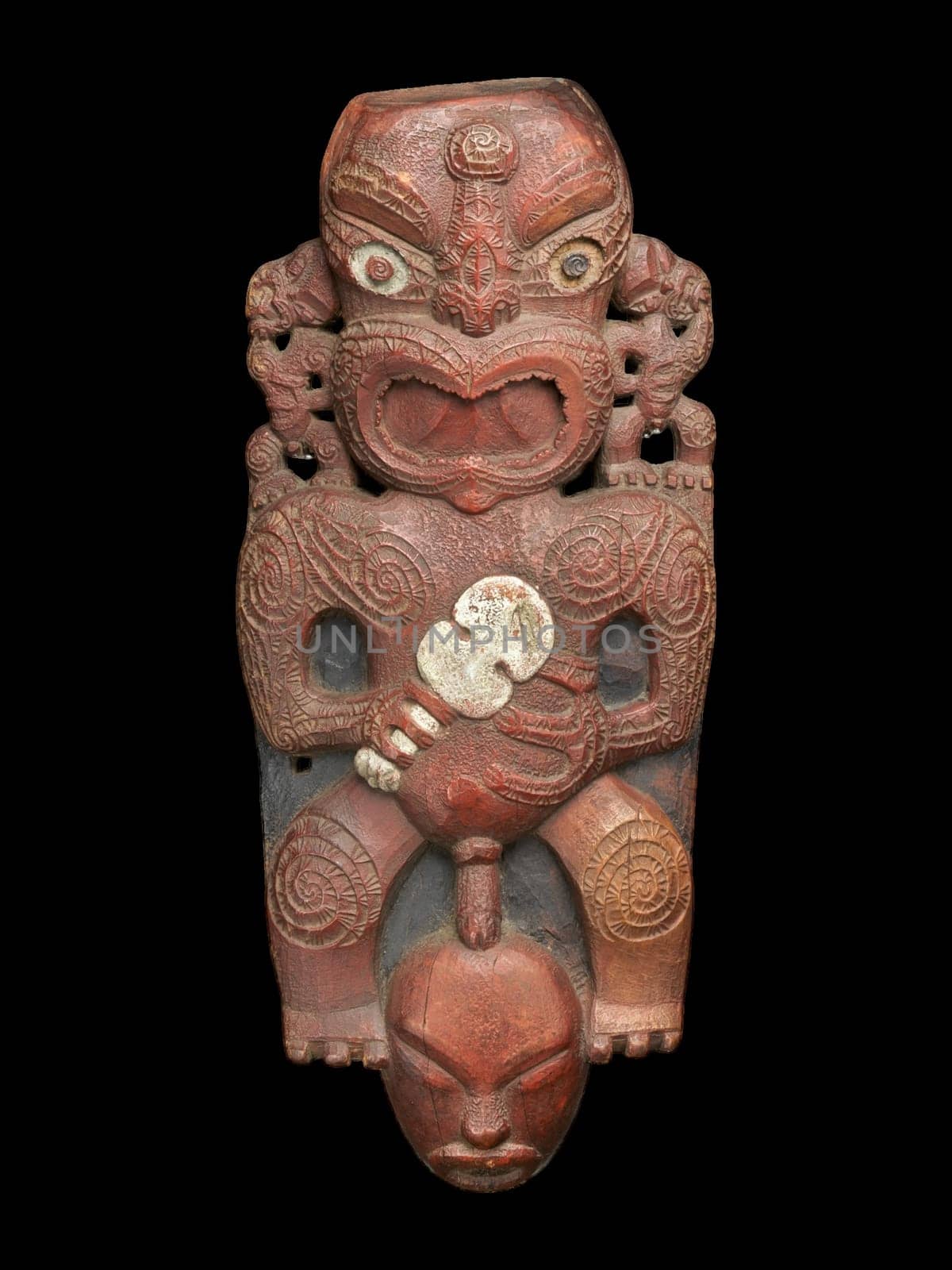 Powerful 1820s Maori Tekoteko gable figure from the Te Arawa tribe. Carved wood with intricate patterns and shell inlay. Represents ancestral power and cultural heritage.