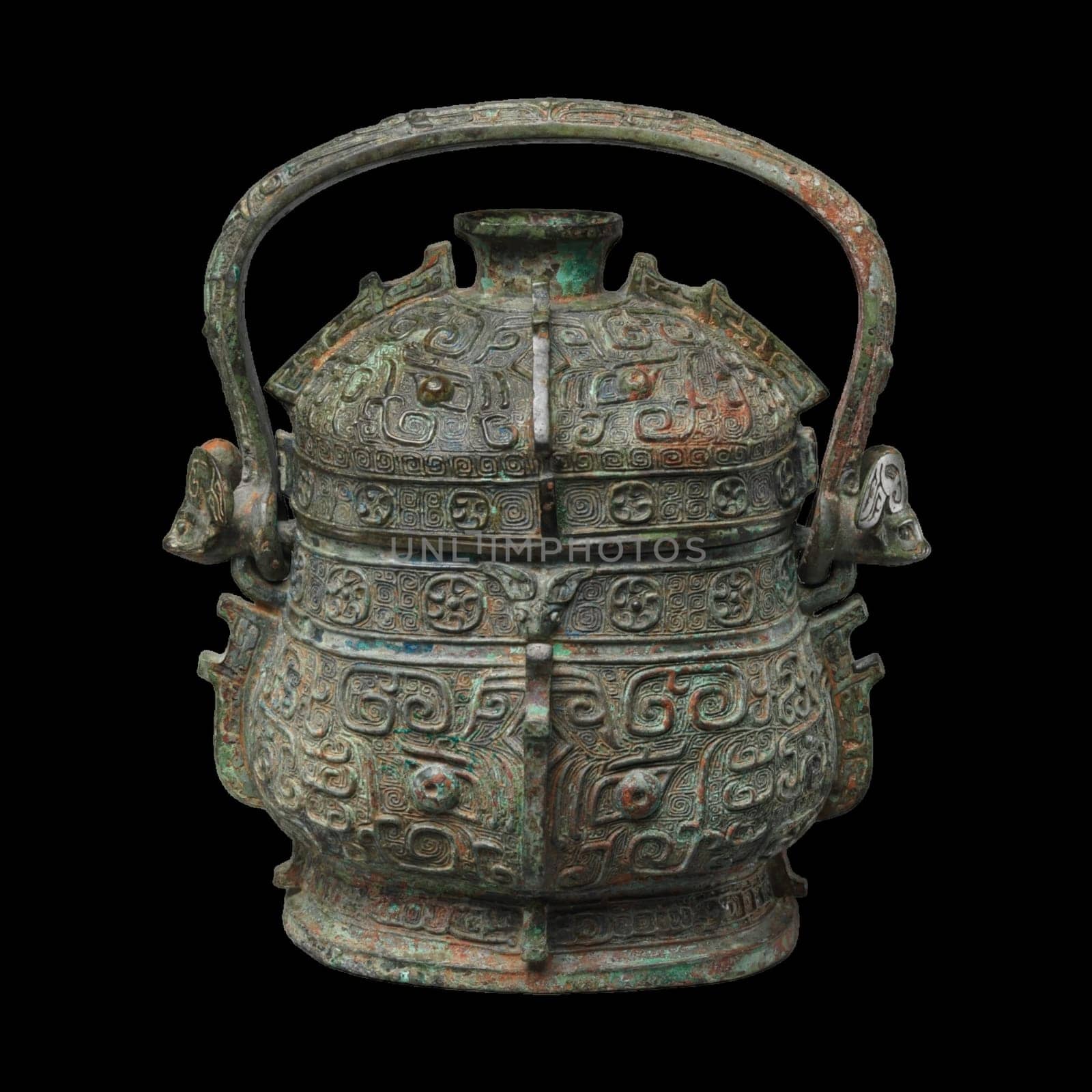 Bronze ritual wine container with a handle from China, dating to the 10th-9th century BCE (Shang Dynasty). Features intricate surface decorations and a weathered texture. Represents ancient Chinese ritual practices and bronze casting.