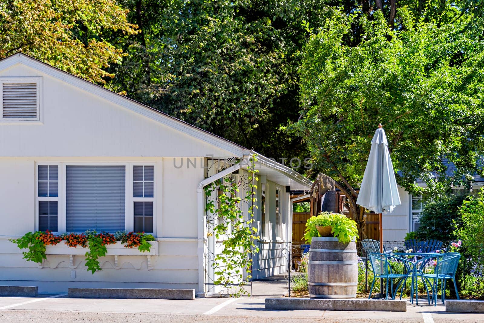White resort house on bright sunny day in Okanagan valley.