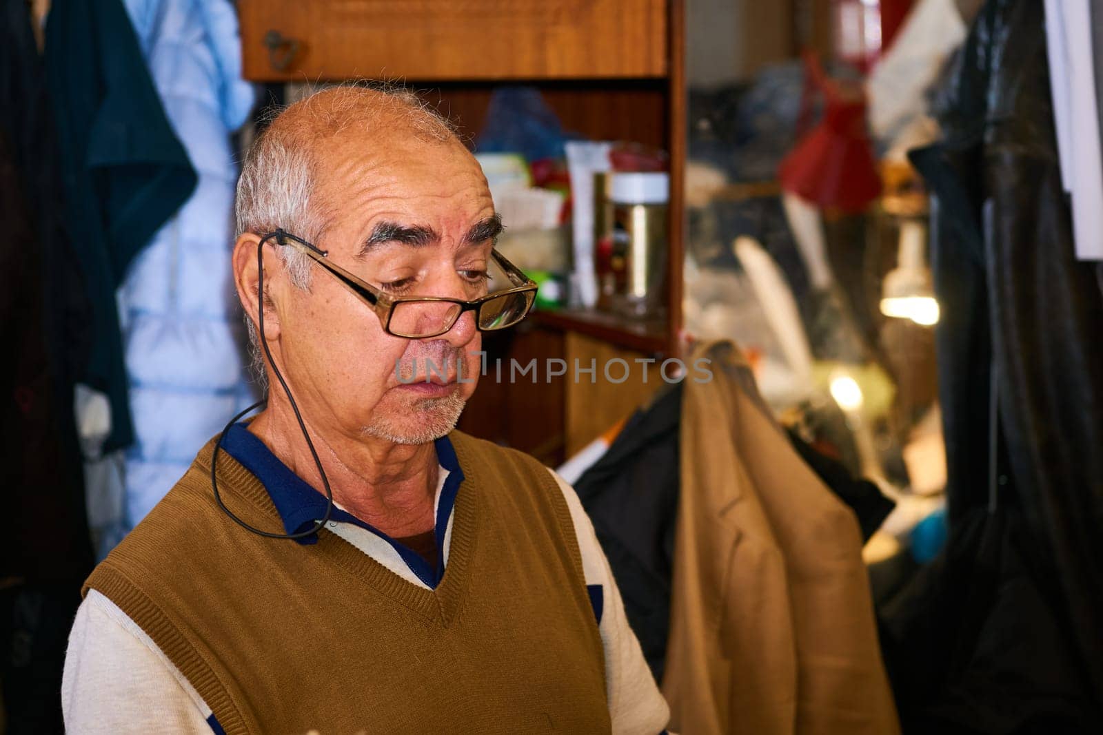 a person whose occupation is making fitted clothes such as suits, pants, and jackets to fit individual customers.