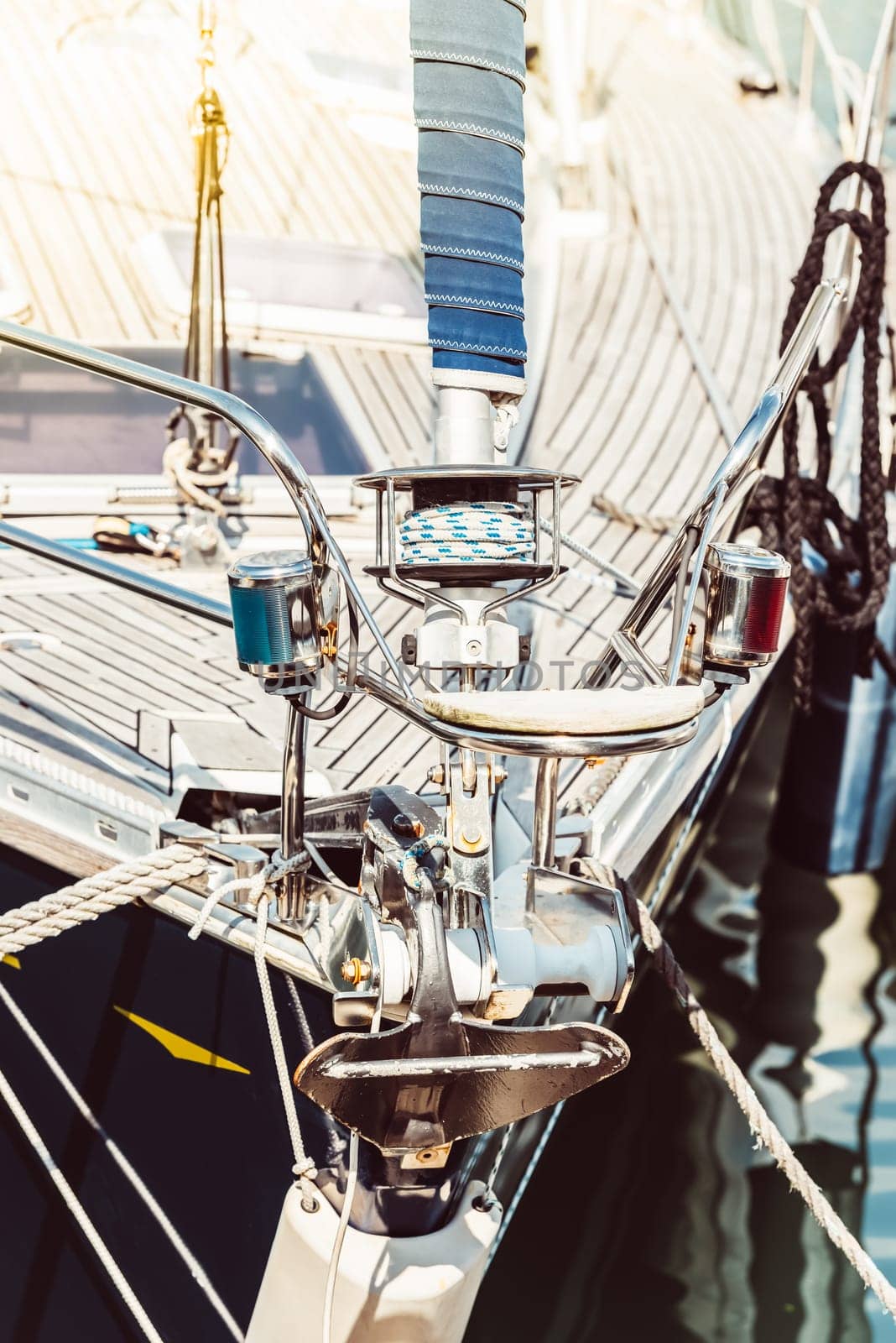 Sailboat deck close-up with ropes and metal fixtures, nautical concept background, 
