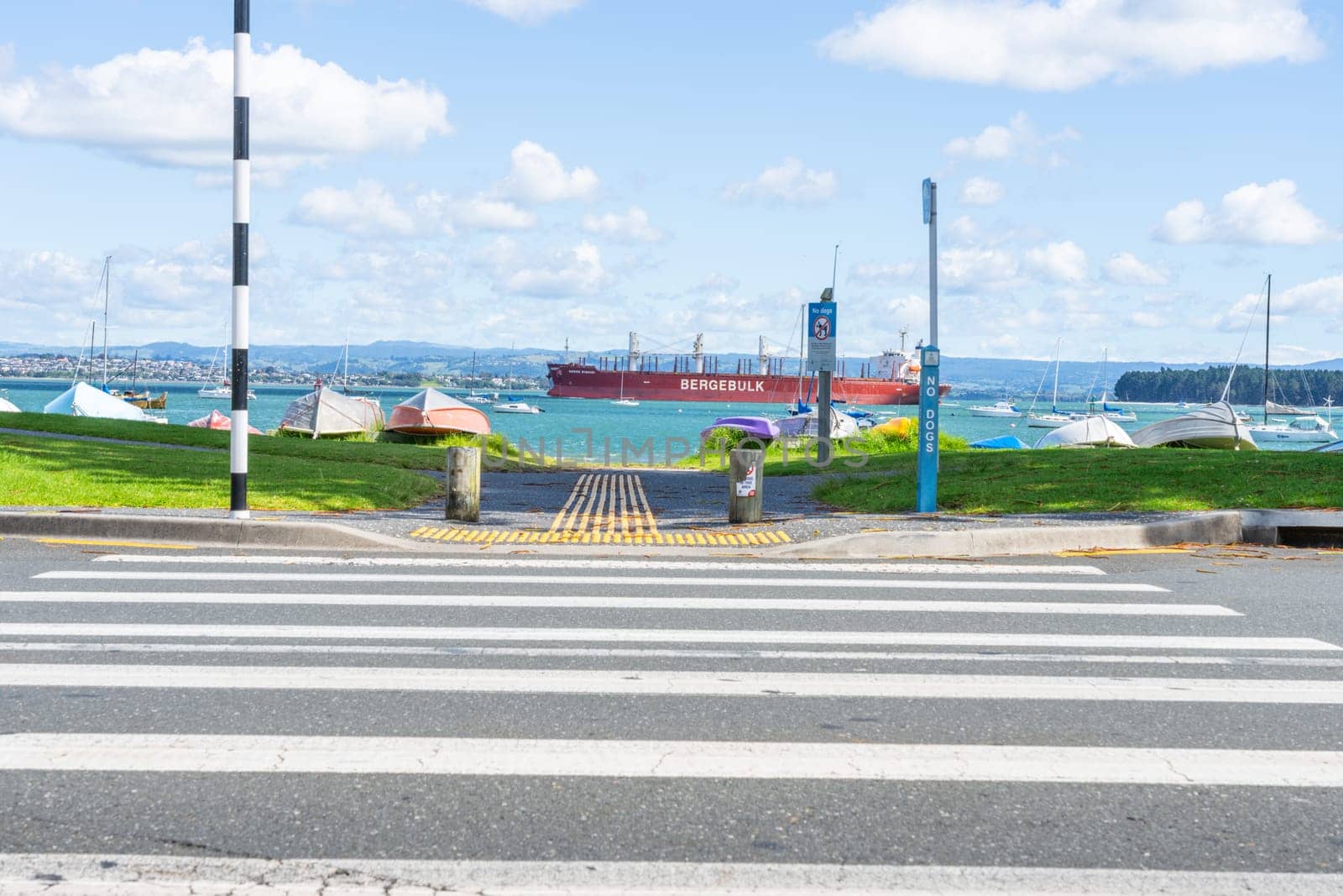 Tauranga New Zealand - March 22 2023: cargo ship Berge Rishi entering Tauranga harbour heading to port