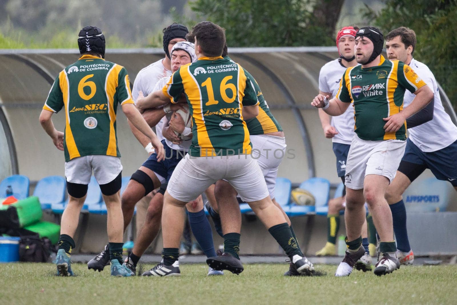 3 may 2025, lisbon. Portugal - oeiras vs ag - rugby players running with the ball and tackling during a rugby match on a green field