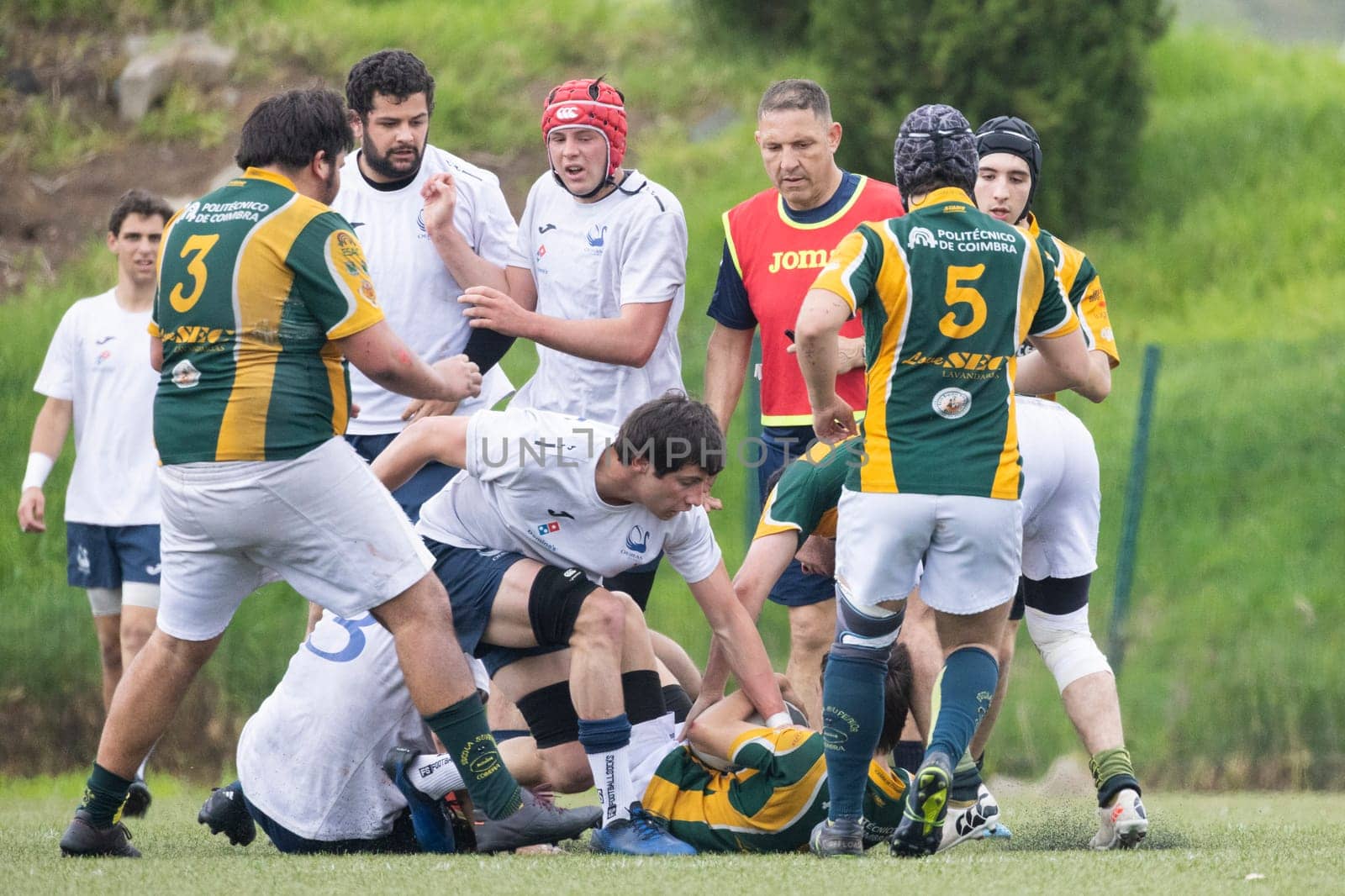 3 may 2025, lisbon. Portugal - oeiras vs ag - rugby players competing for the ball during a rugby match on a green field
