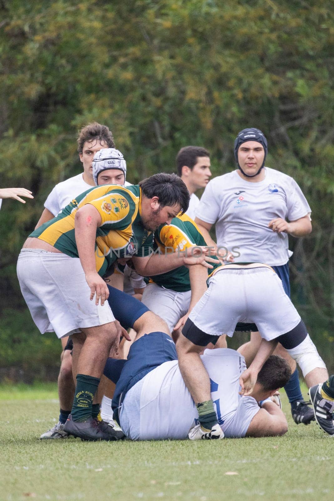 3 may 2025, lisbon. Portugal - oeiras vs ag - rugby players forming a scrum and competing for the ball on a green field