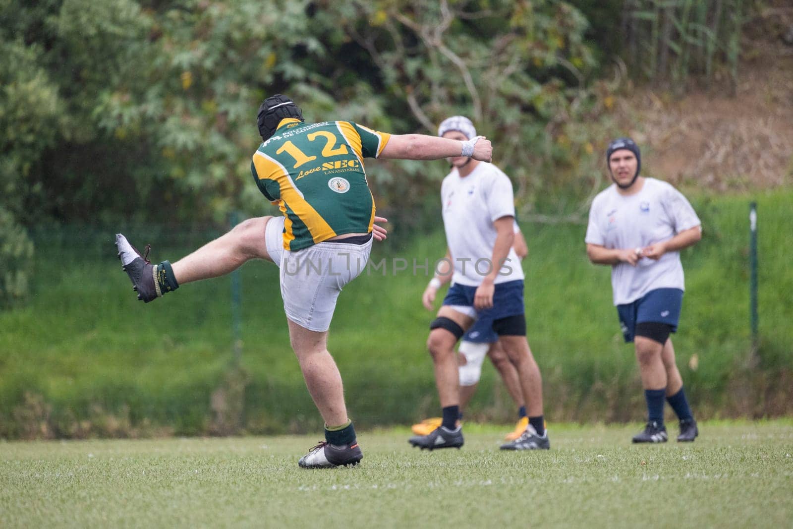 3 may 2025, lisbon. Portugal - oeiras vs ag - rugby player kicking the ball during a match on a green field