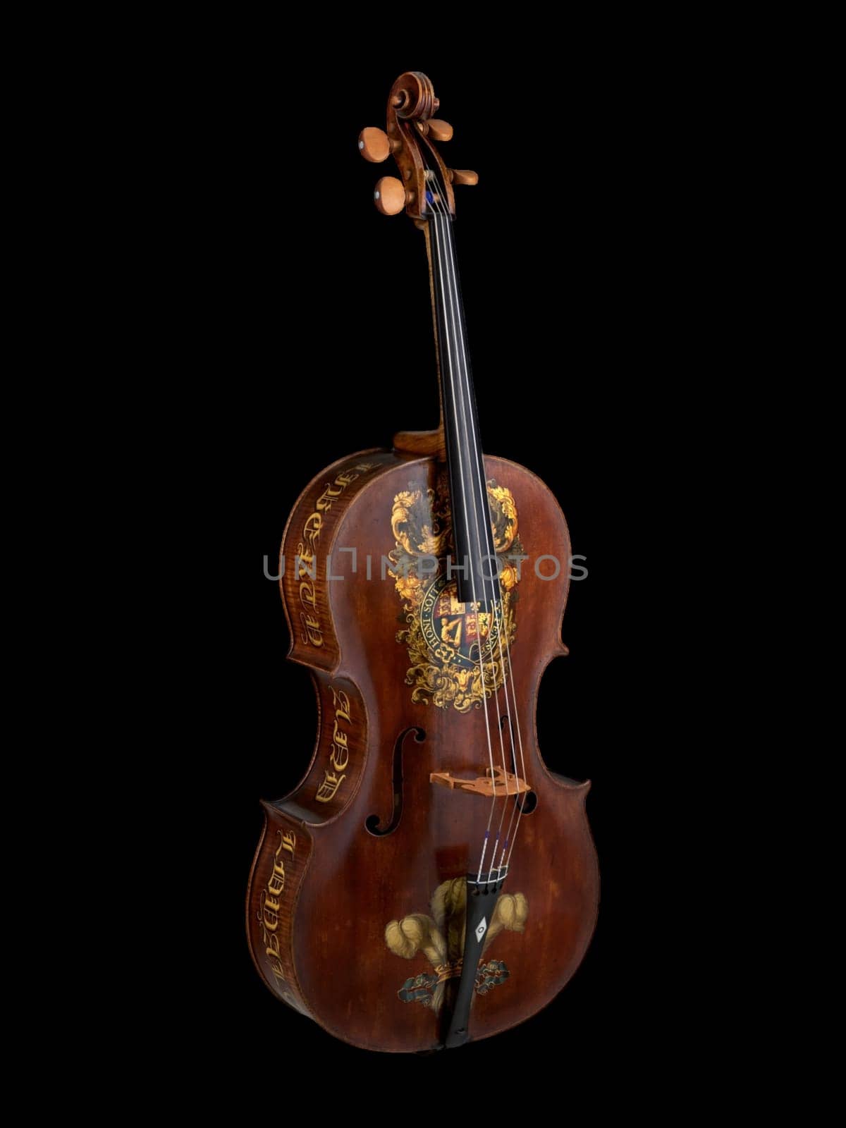 Antique "Royal George" cello crafted by William Forster in 1782. Features ornate floral decorations on rich brown wood. Represents historical musical instrument craftsmanship.