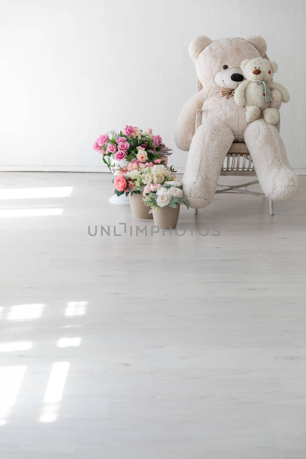 Polar bear toy flower baskets and gifts in the interior of a white room