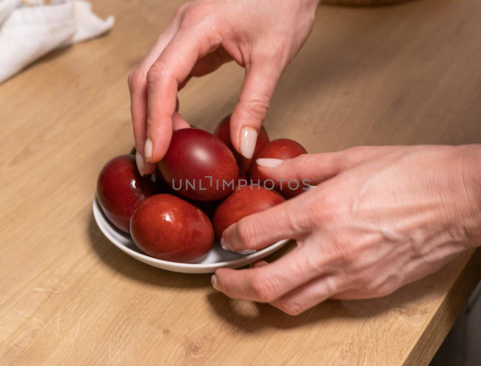 Woman holds Easter eggs just colored with onion peel