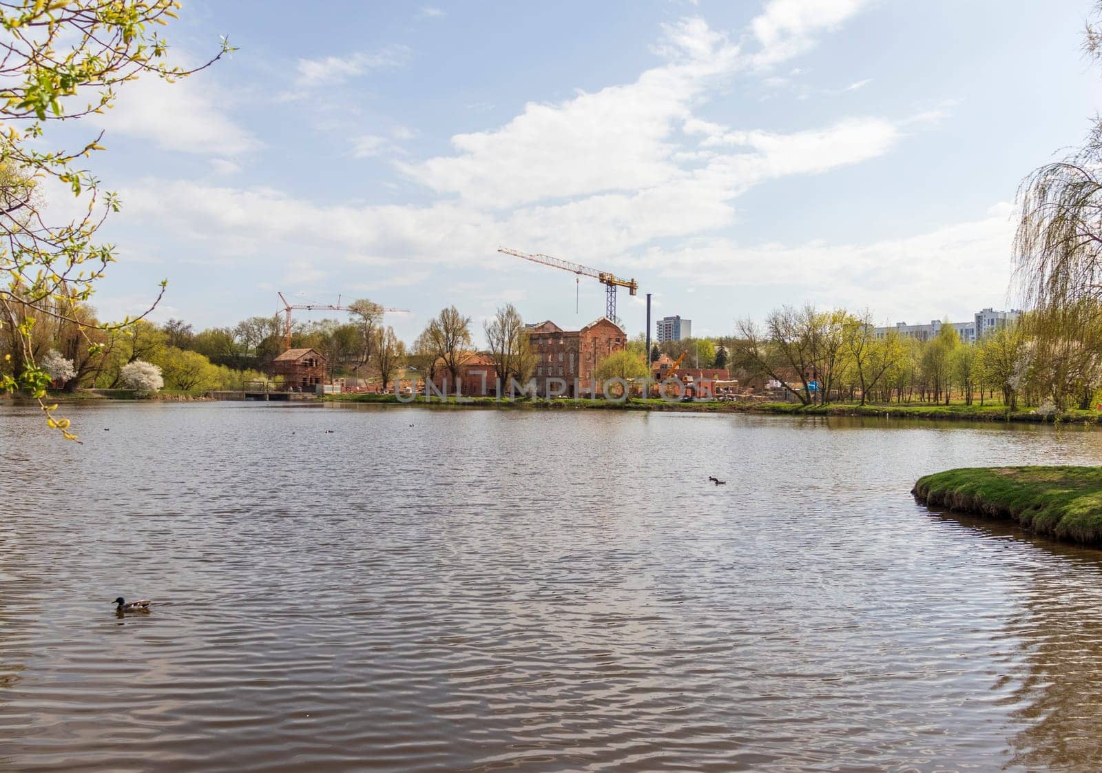 Construction cranes on site of restoration of the catholic church