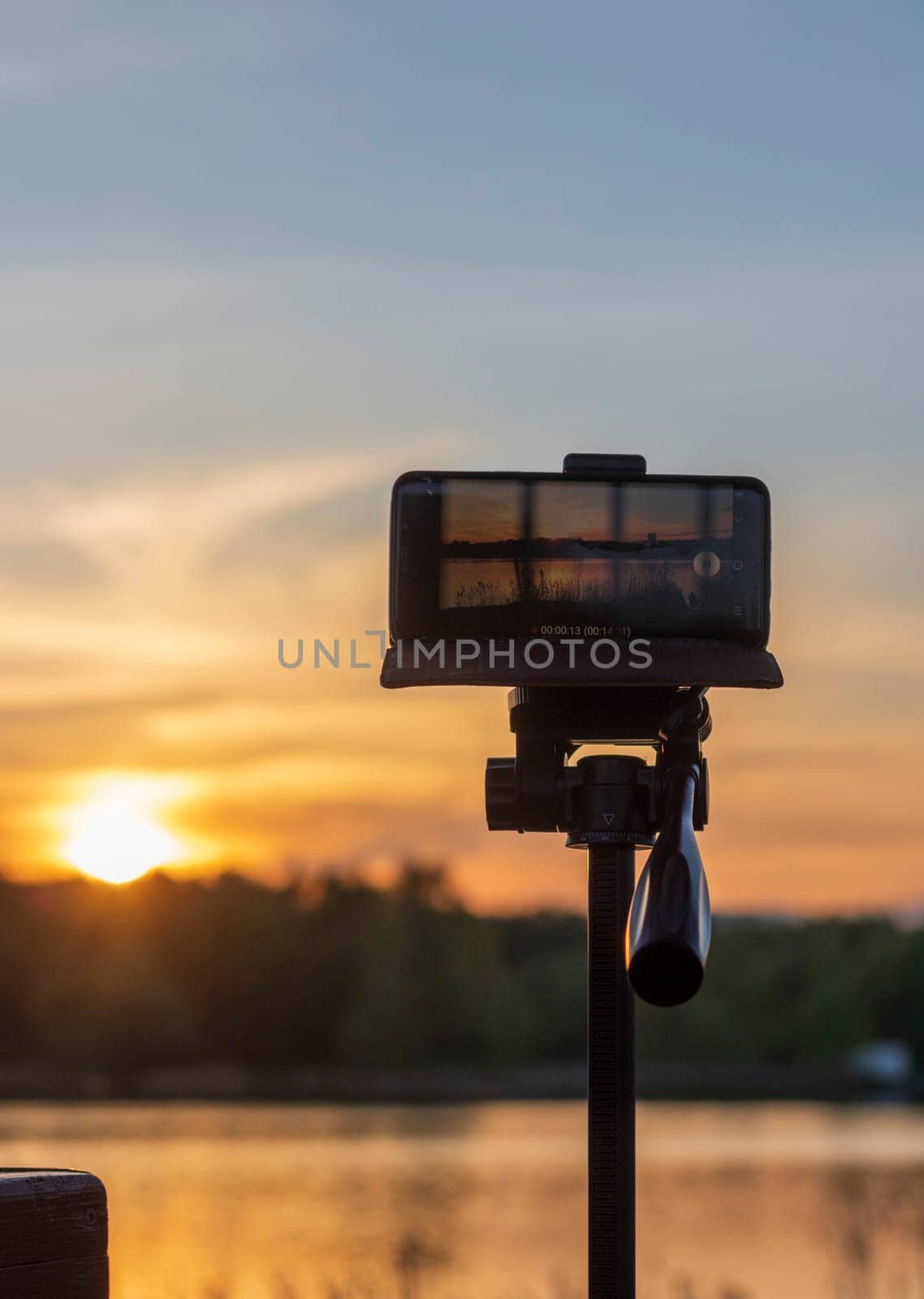Cell phone on the tripod capturing sun set moment