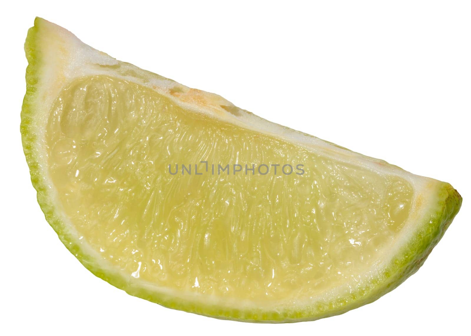 Close-up of a fresh lime wedge with juicy pulp and a bright green peel, isolated background