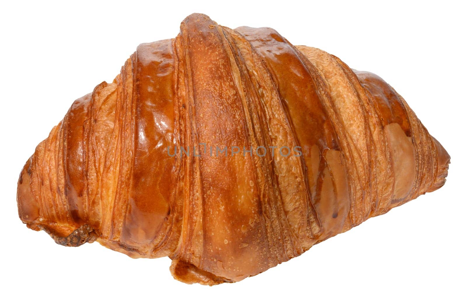 Appetizing, golden brown croissant with a glossy surface. Isolated background