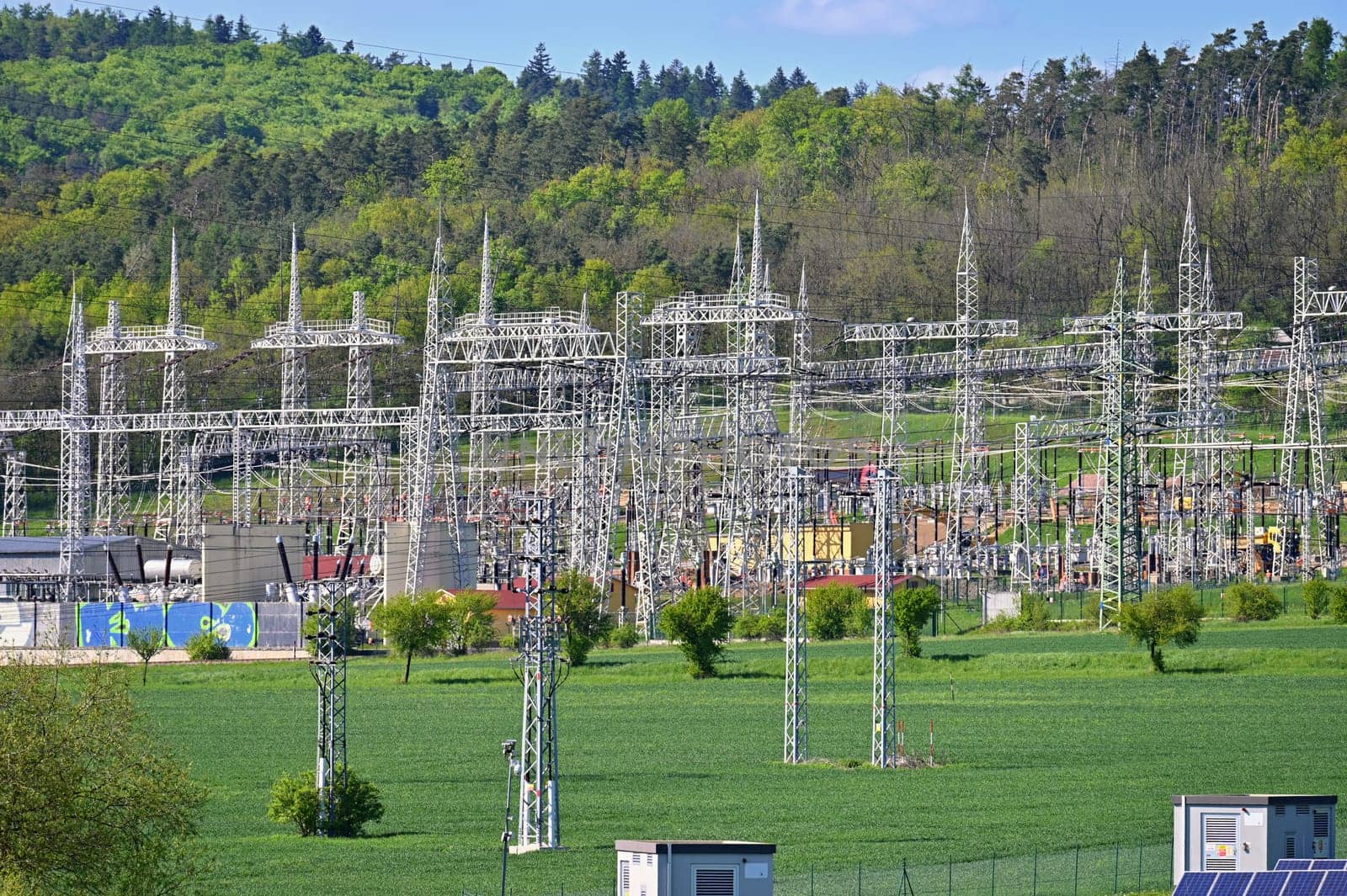Electric power poles. Power plant - current distribution station. Concept for industry and technology with electricity.