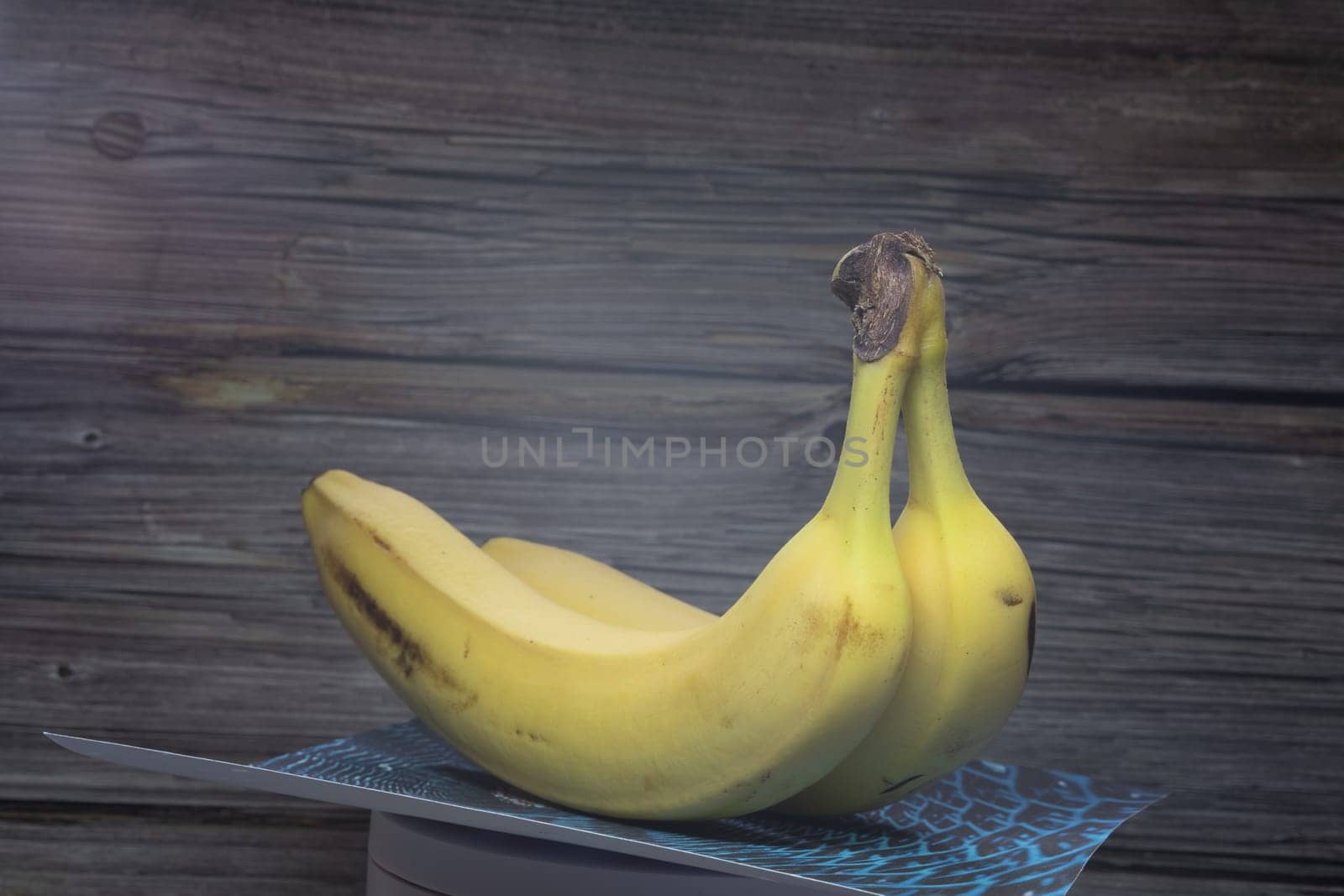 yellow sweet bananas on table move arround