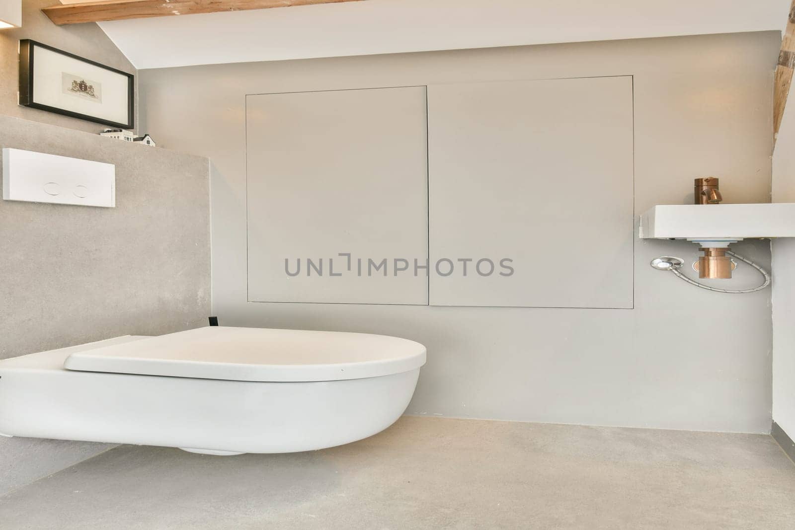 A sleek and contemporary bathroom featuring a white toilet, neutral tones, and minimalist decor. Ideal for modern interior inspiration and design.