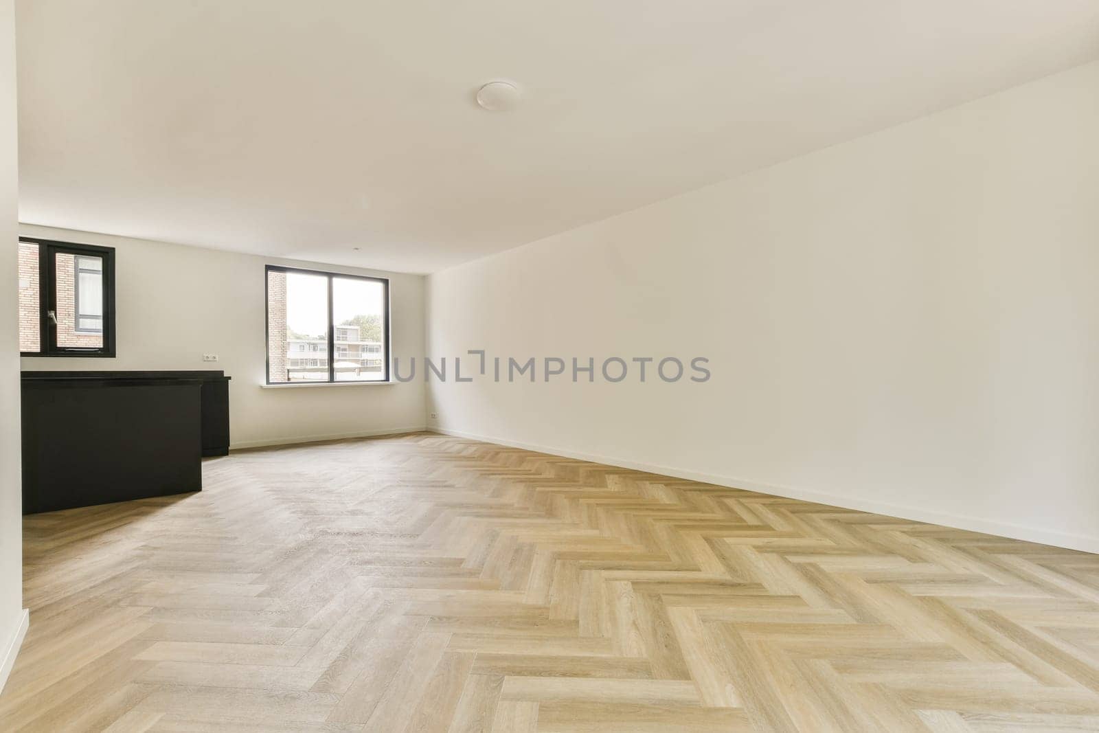 A spacious, modern interior showcasing a minimalist aesthetic with simple lines and a light color palette. Perfect for showcasing contemporary living spaces.