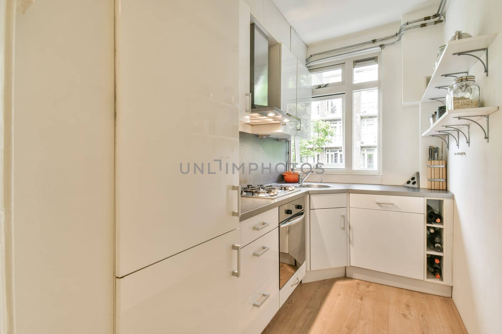 Stylish modern kitchen featuring clean lines, a bright atmosphere, and efficient storage solutions. The design maximizes space while offering functionality.