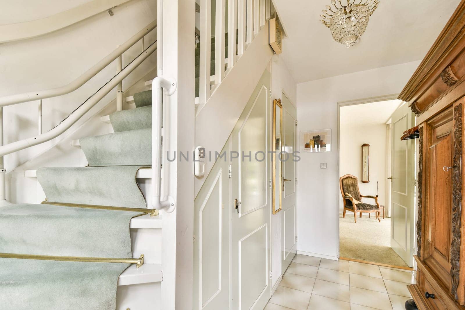 A bright and inviting modern interior showcasing a plush staircase, elegant decor, and light-filled rooms that create a cozy atmosphere.