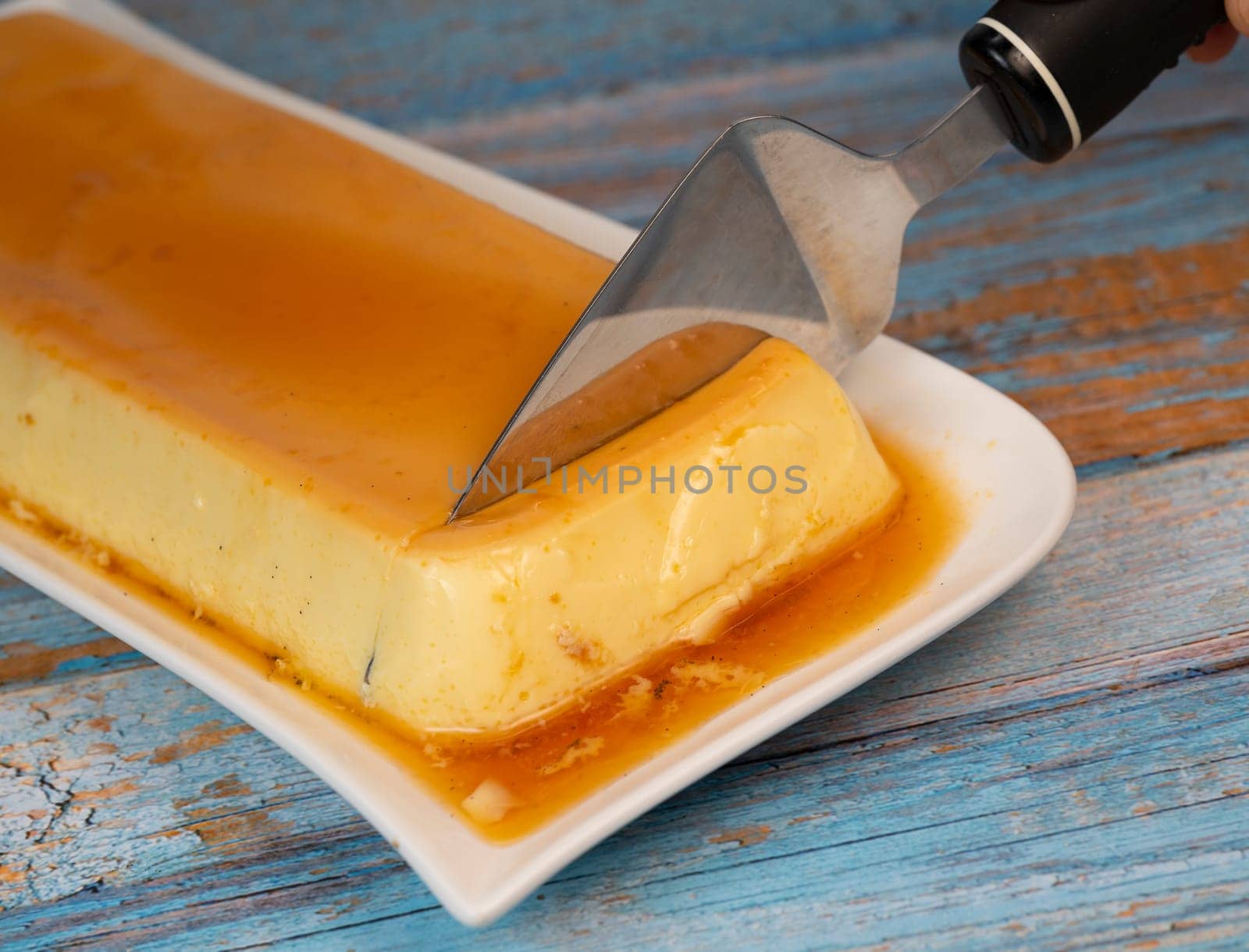Cream caramel pudding with caramel sauce on a plate, Flan, High quality photo