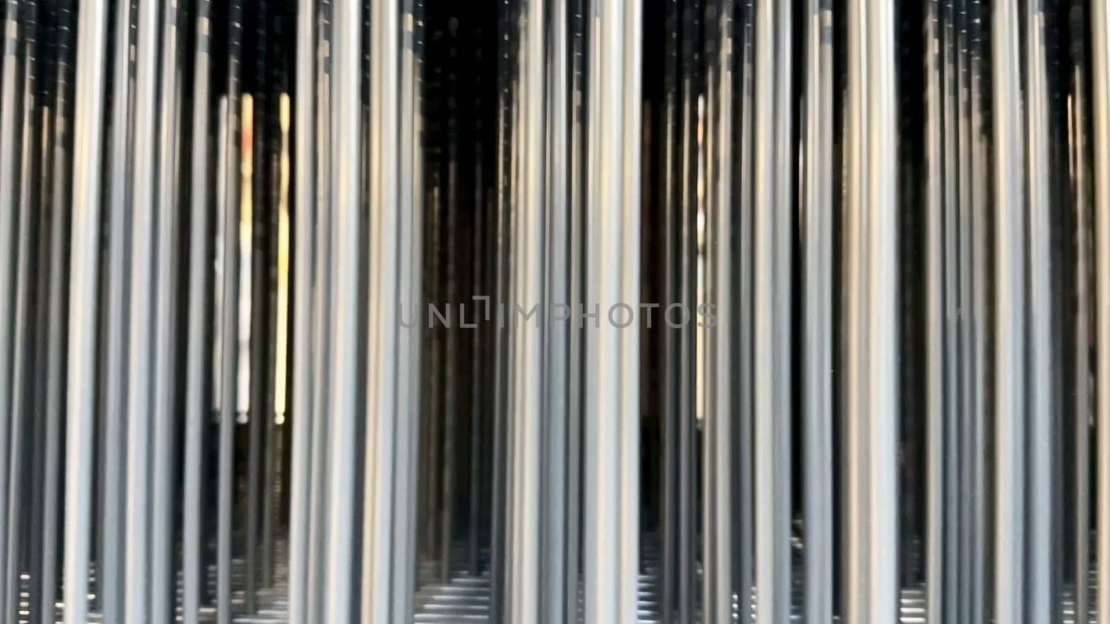 A stunning visual of metallic columns reflecting light, creating an exceptional abstract aesthetic that captivates