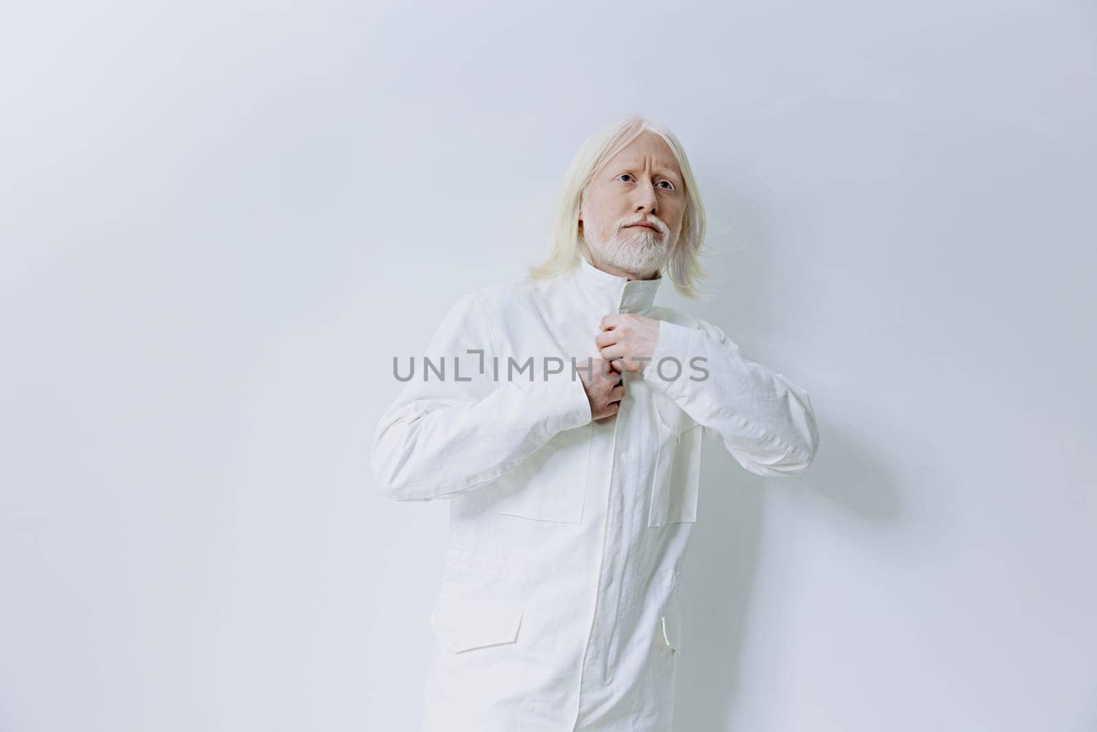 A stylish model dressed in a white outfit stands confidently against a soft light backdrop The look portrays sophistication and modernity, ideal for fashion, lifestyle, and editorial visuals
