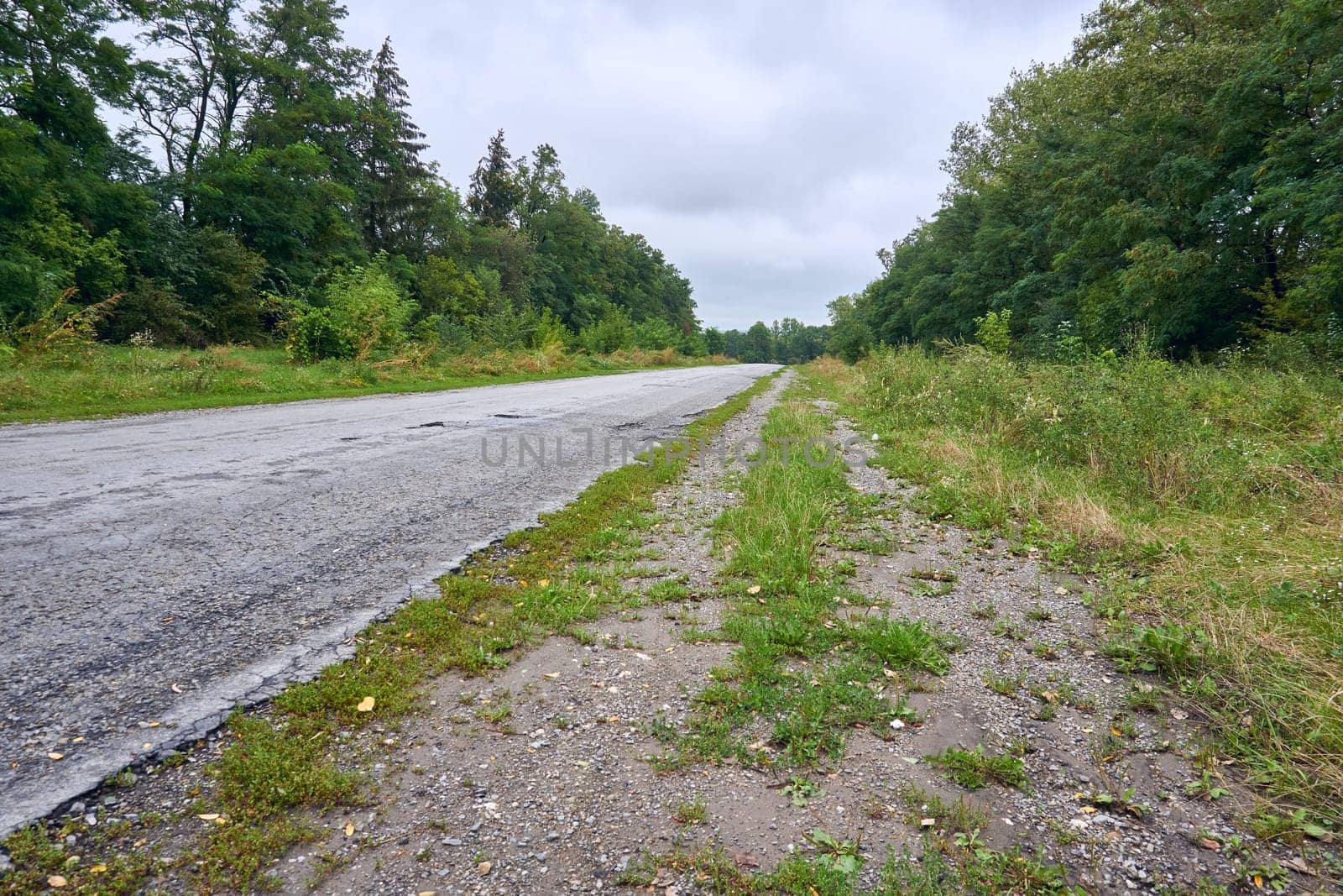 a wide way leading from one place to another, especially one with a specially prepared surface which vehicles can use
