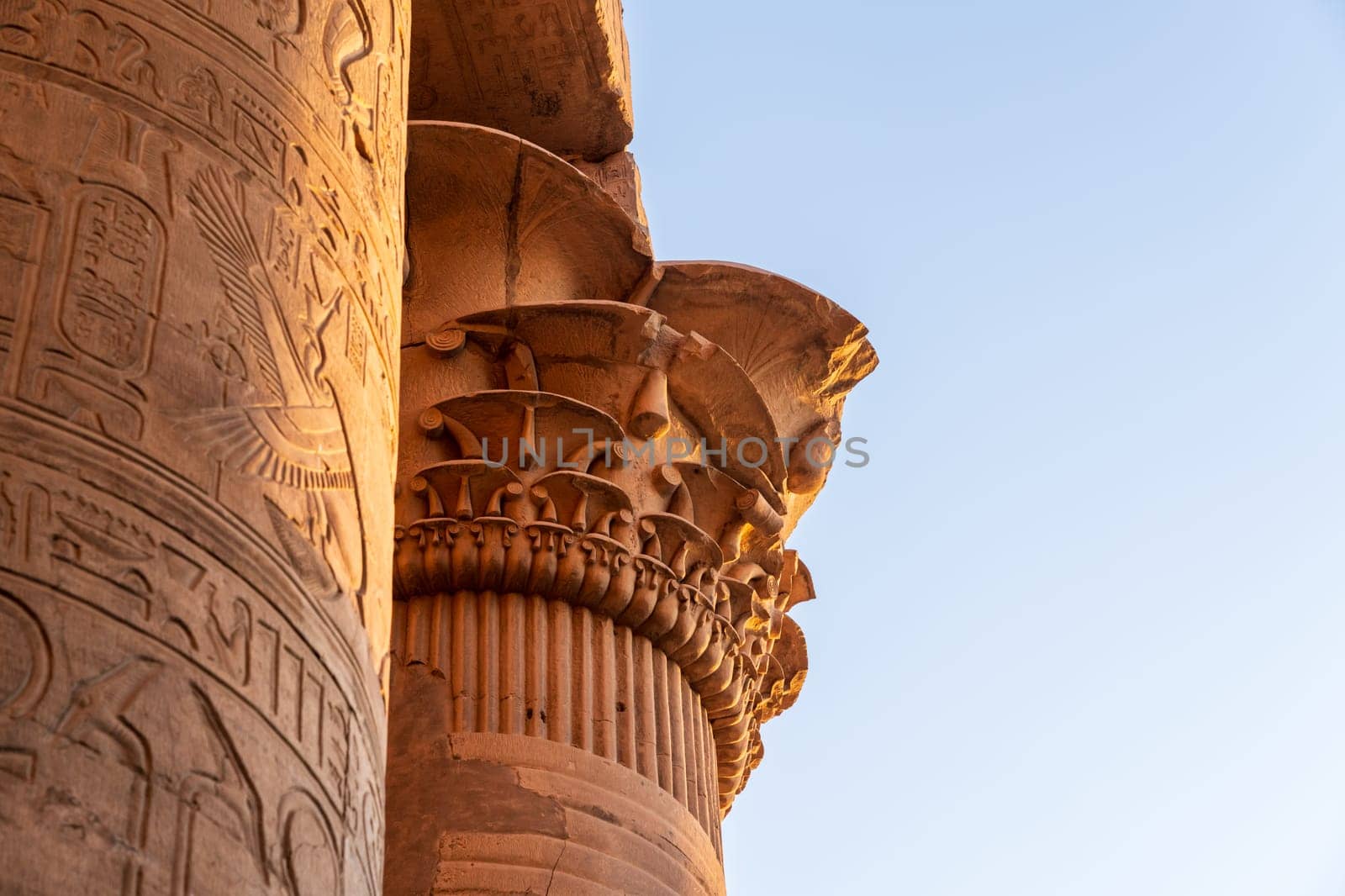 Details of the carvings on the capitals of columns at Temples of Sobek and Horus at Kom Ombo at sunset