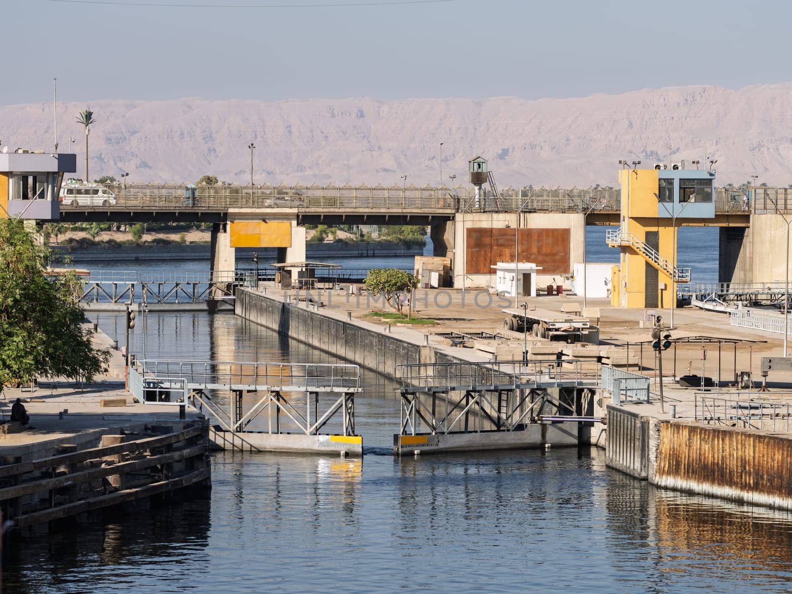 Approaching the new Esna dam and lock on Nile River with gates open for entry
