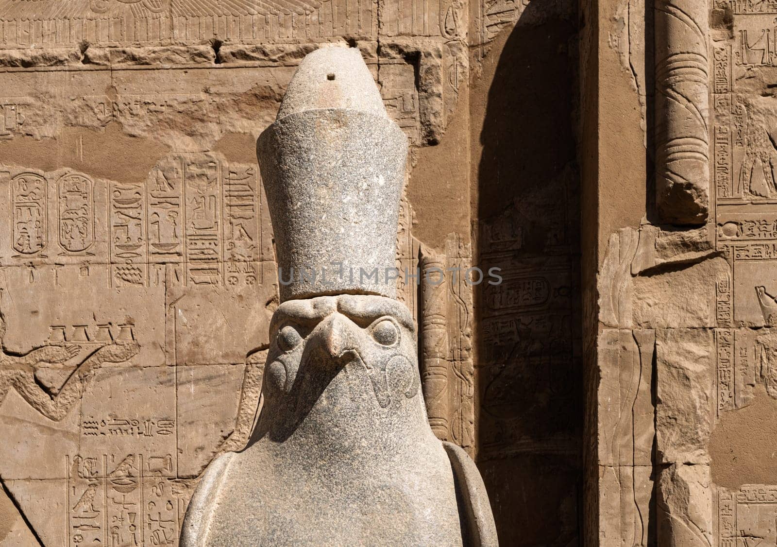 Detail of the carved statue of Horus outside the Pylon at the entrance of the massive temple in Edfu dedicated to Horus and Hathor