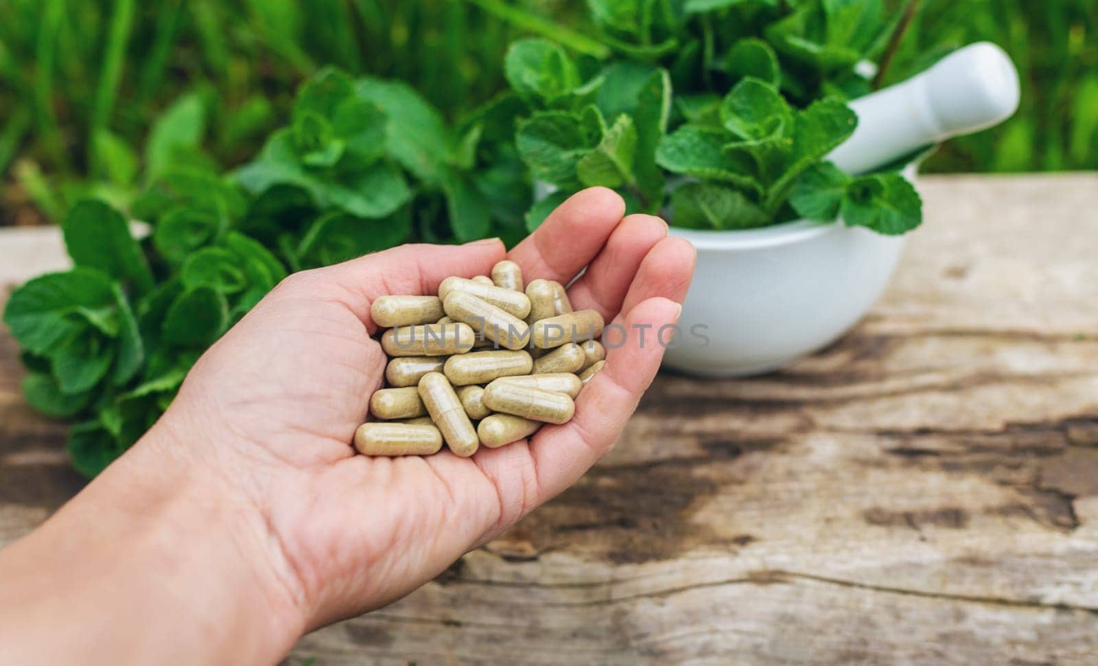 Peppermint extract essential oil and supplements. Selective focus. nature.