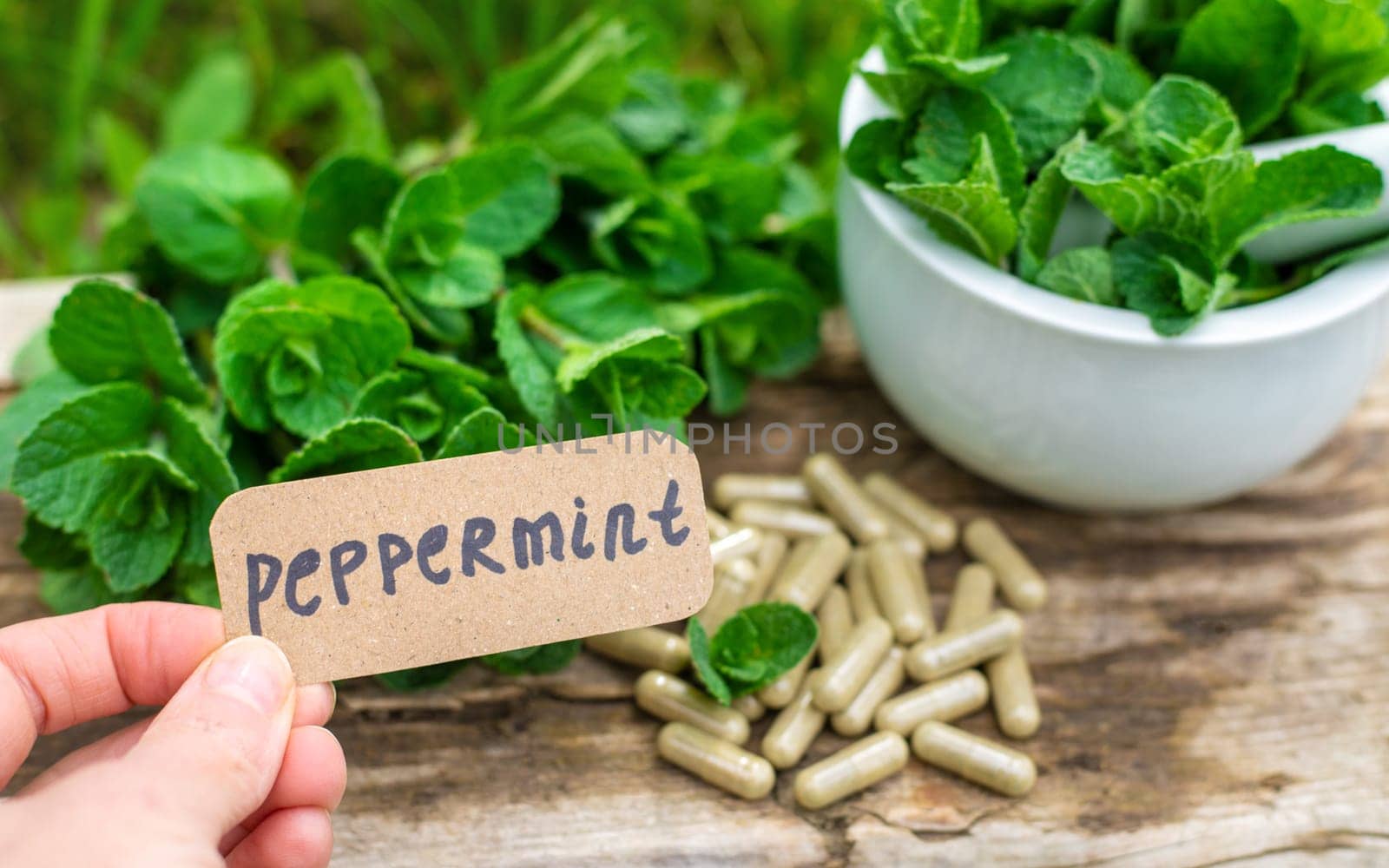 Peppermint extract essential oil and supplements. Selective focus. nature.